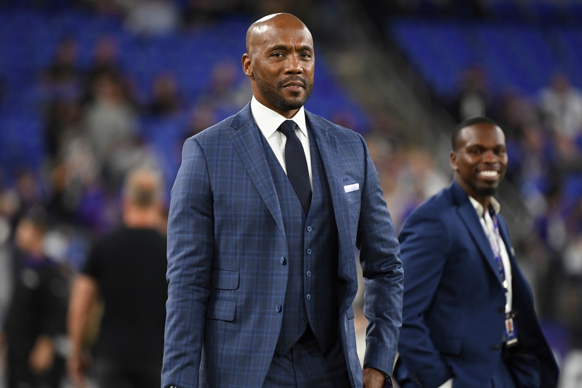 Louis Riddick walks on the field during pre-game warm-ups before an NFL football game.
