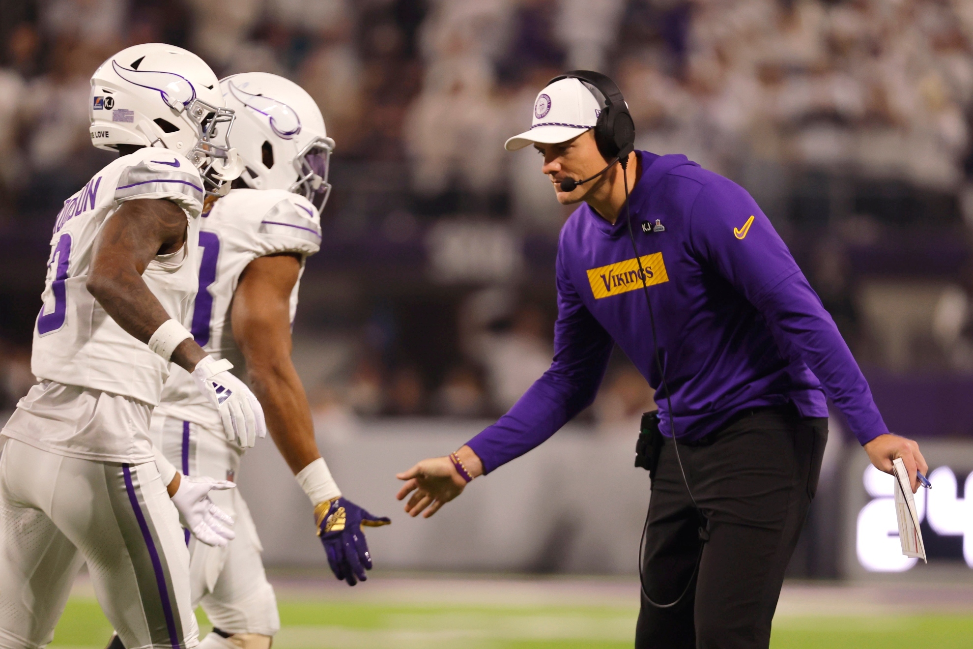 Minnesota Vikings head coach Kevin OConnell celebrates with his team during the first half of an NFL football game against the Chicago Bears, Monday, Dec. 16, 2024, in Minneapolis.