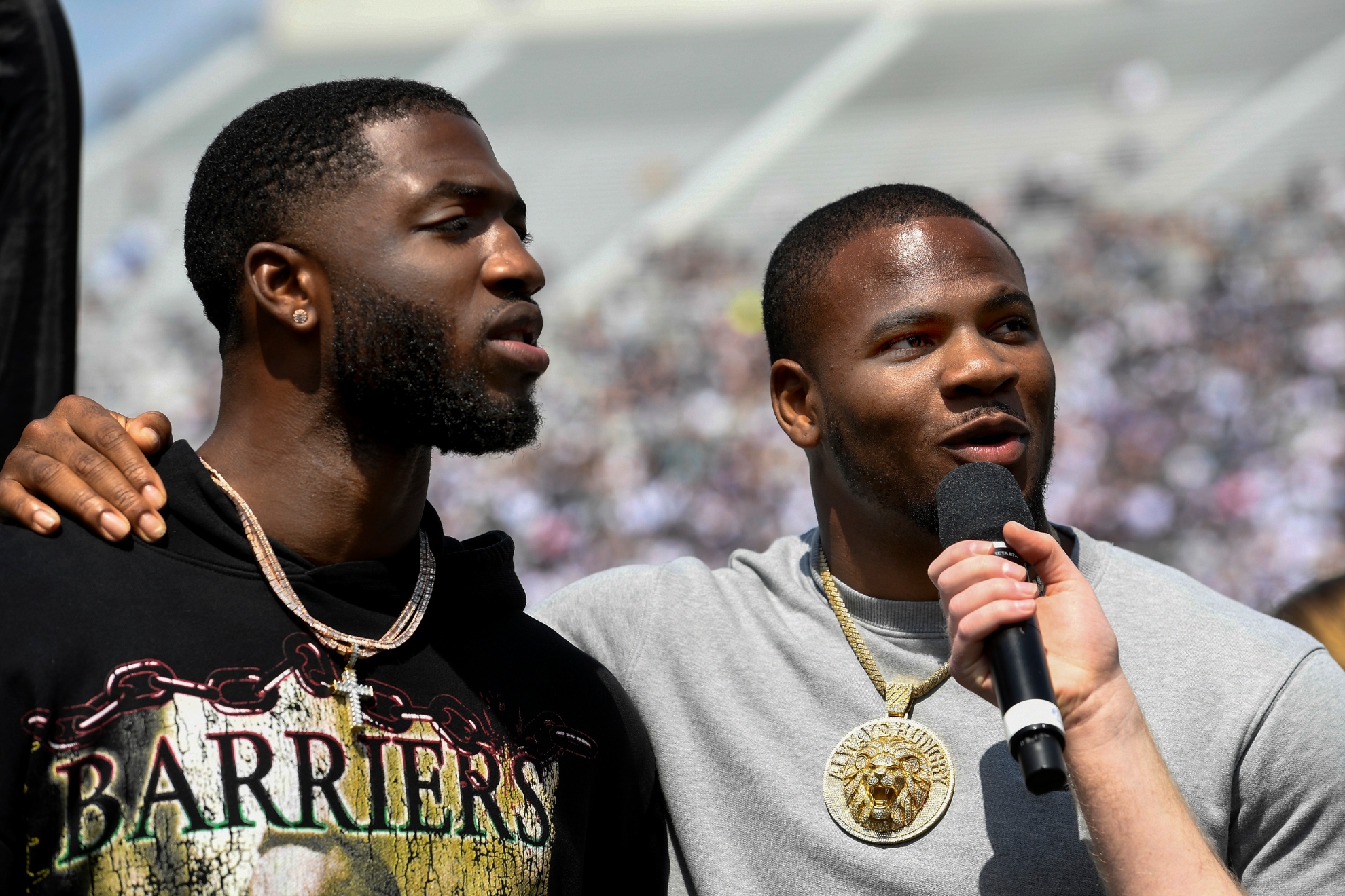 Former Penn State players Odafe Oweh and Micah Parsons talk to the fans during an NCAA college spring football game Saturday, April 23, 2022, in State College, Pa