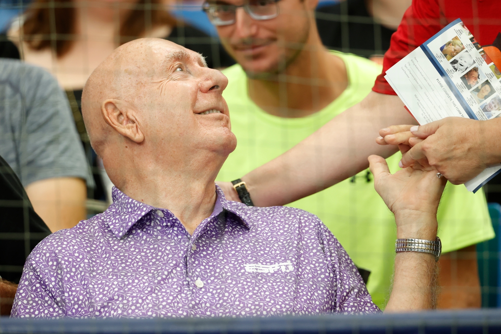 Dick Vitale talks with a fan before the start of a baseball game between the Tampa Bay Rays and the Baltimore Orioles in 2023.