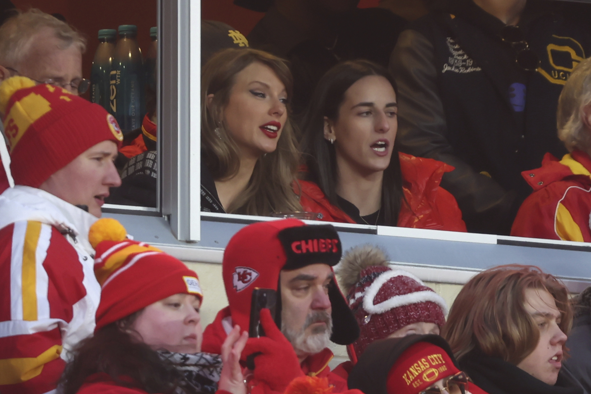 Taylor Swift (left) watches from a suite with Caitlin Clark, the NFL AFC divisional playoff game