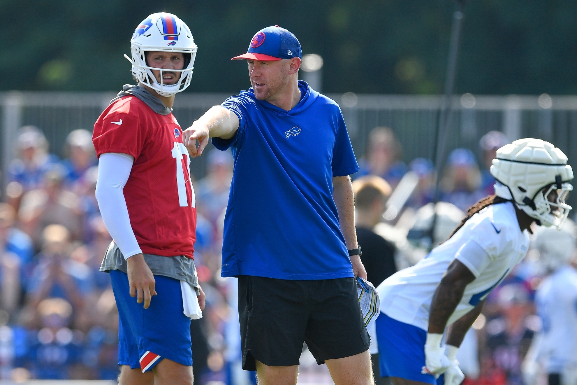 Buffalo Bills offensive coordinator Joe Brady, right, talks with quarterback Josh Allen (17) during an NFL football training camp practice in Pittsford, N.Y., Wednesday, July 24, 2024.