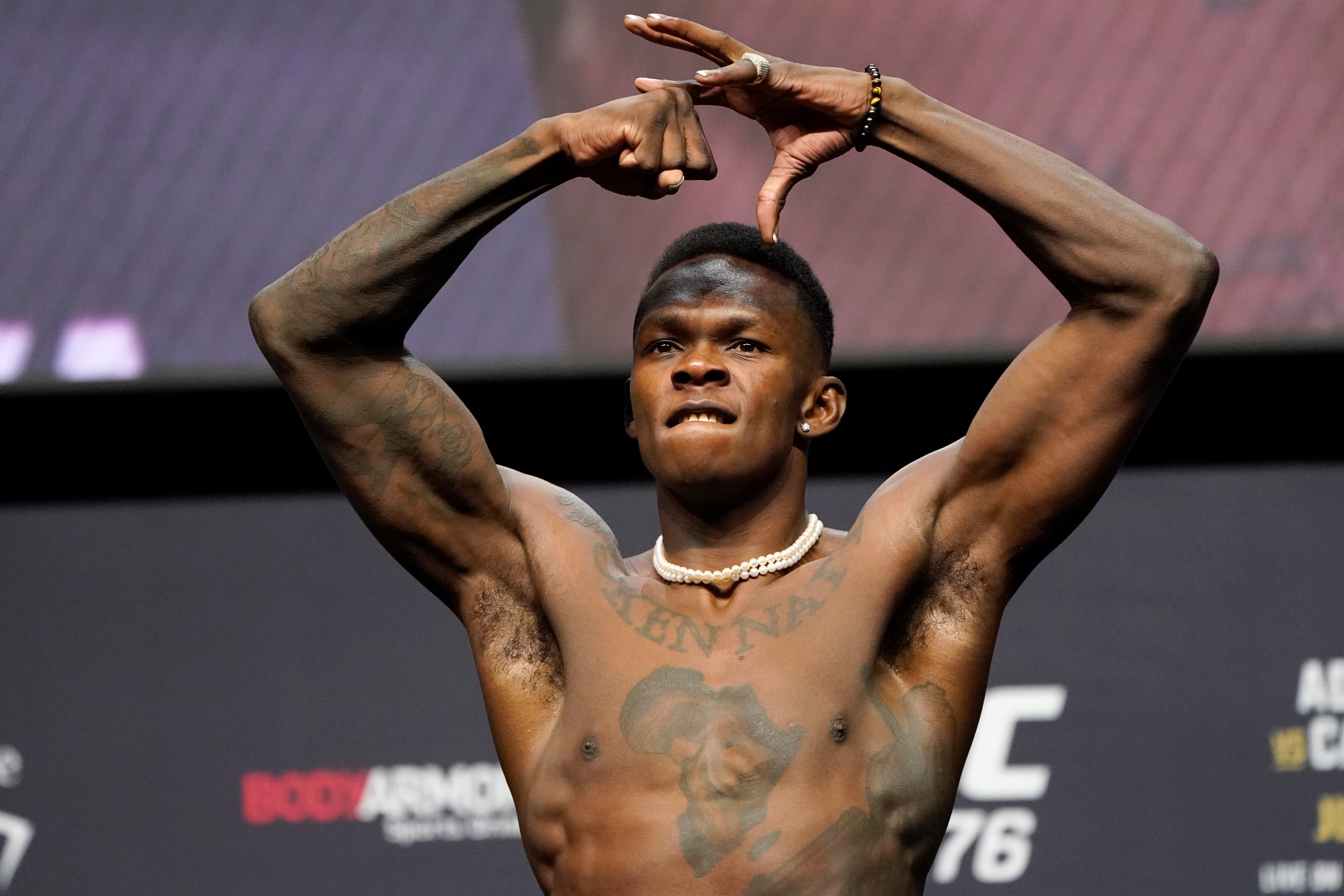 Israel Adesanya poses during a ceremonial weigh-in Friday, July 1, 2022, in Las Vegas. Adesanya is scheduled to fight Jared Cannonier in a middleweight title mixed martial arts bout Saturday at UFC 276 in Las Vegas.