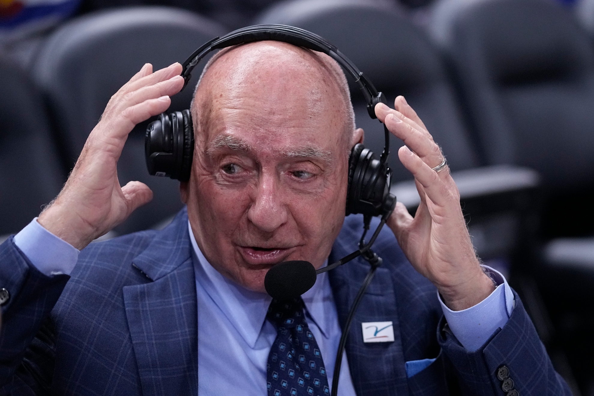 Dick Vitale prepares to announce an NCAA college basketball game.