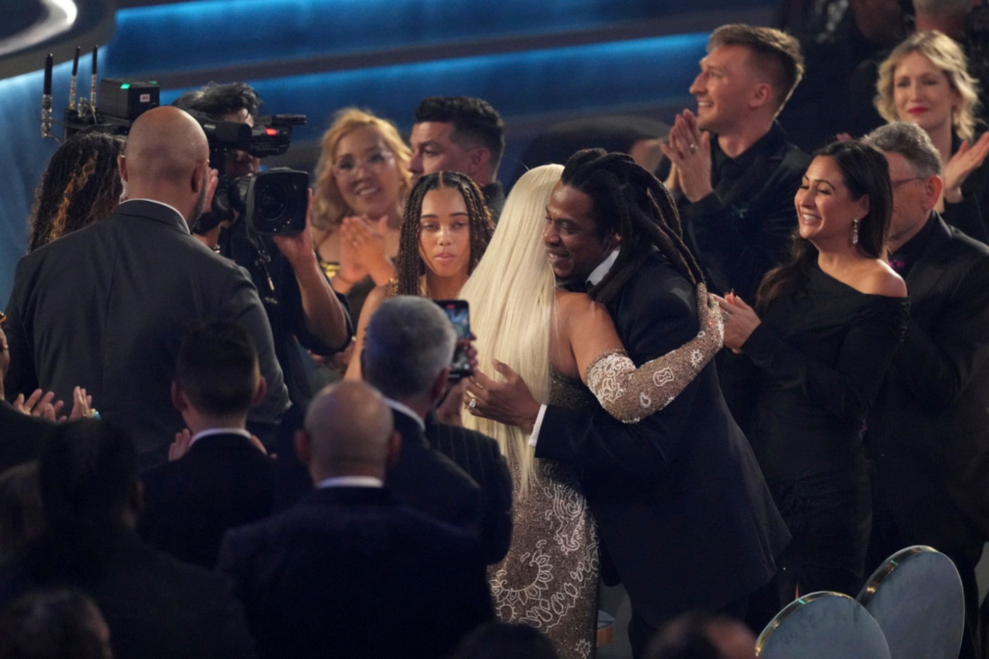 Jay-Z, right, embraces Beyonce after she wins award for album of the year for COWBOY CARTERthe during the 67th annual Grammy Awards on Sunday, Feb. 2, 2025, in Los Angeles. (AP Photo/Chris Pizzello)