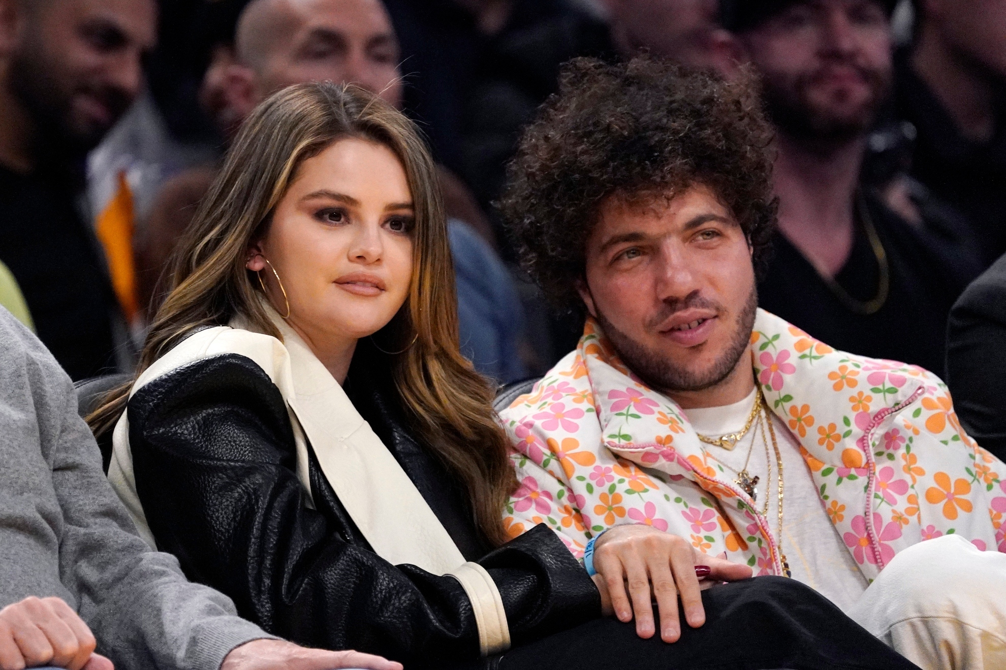 Actress Selena Gomez, left, and actor Benny Blanco watch during the first half of an NBA basketball game between the Los Angeles Lakers and the Miami Heat on Wednesday, Jan. 3, 2024, in Los Angeles