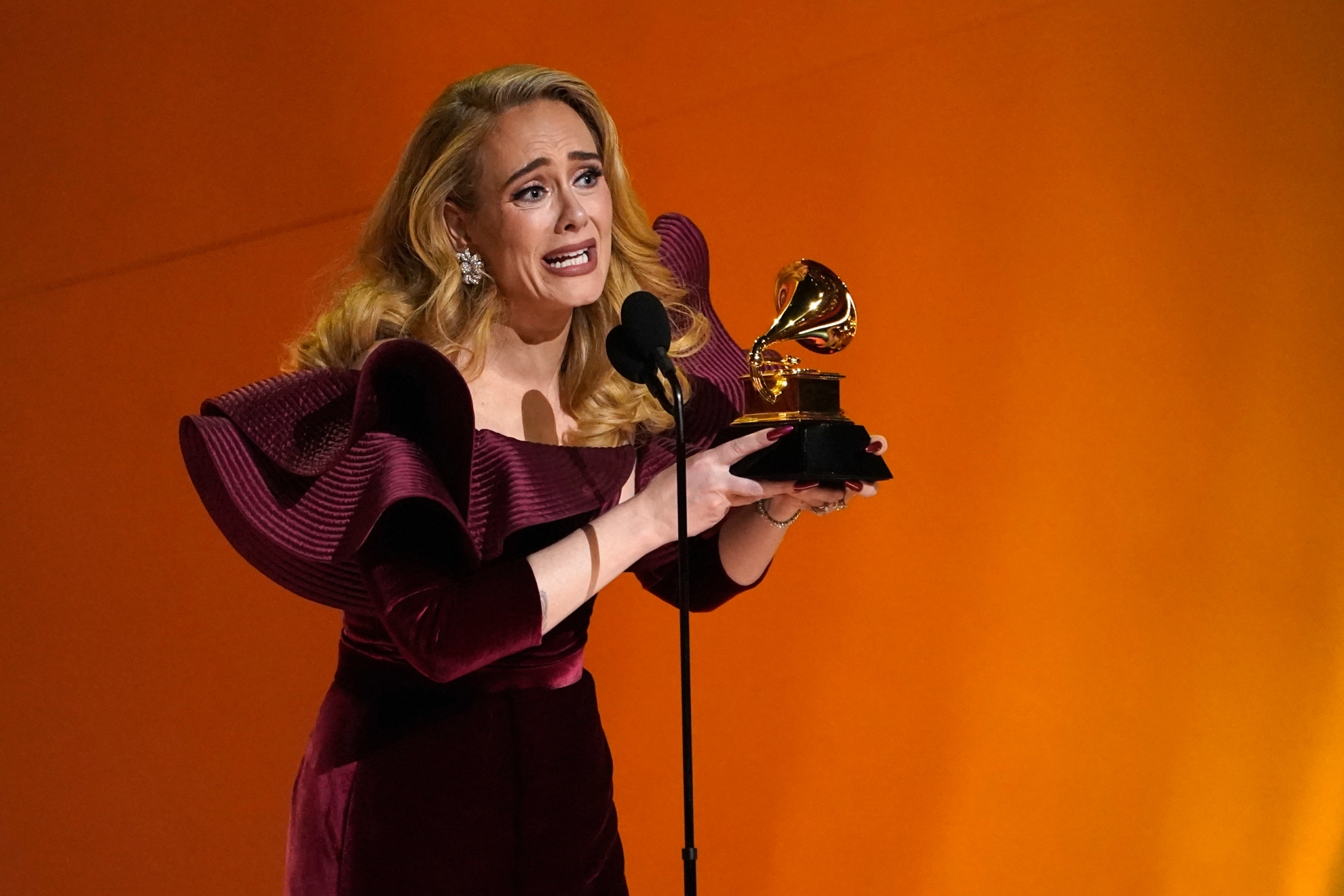Adele accepts the award for best pop solo performance for Easy On Me at the 65th annual Grammy Awards in 2023.