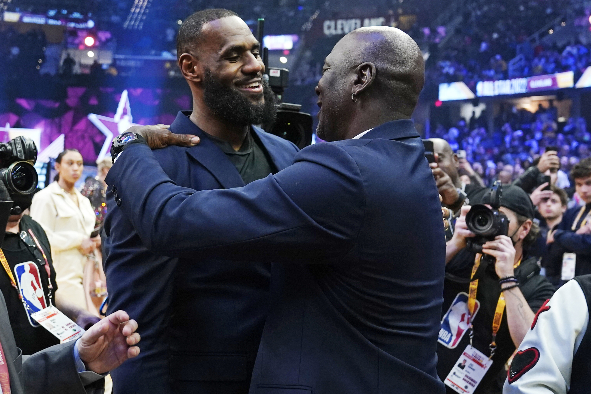 Los Angeles Lakers LeBron James, left, embraces NBA legend MIchael Jordan during the NBA All-Star game