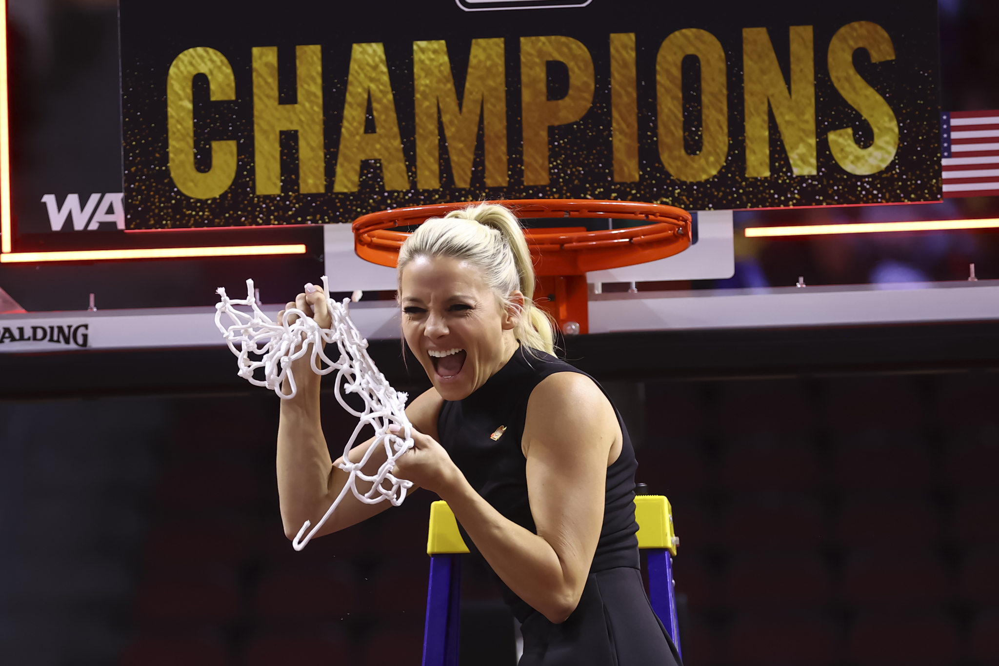 Former Grand Canyon head coach Molly Miller cuts down the net after the teams victory in the championship of the Western Athletic Conference tournament