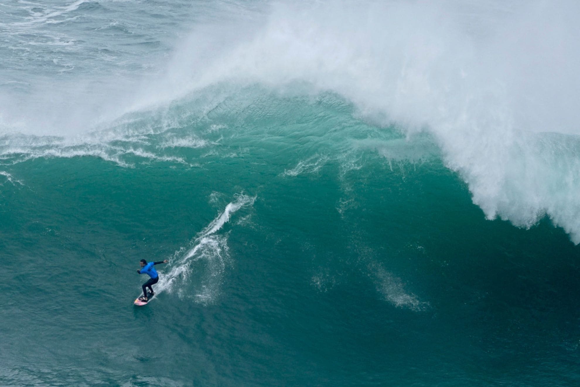 Ben Larg, from Scotland, rides a wave during the Nazare Big Wave Challenge surfing tournament at Praia do Norte, or North Beach, in Nazare, Portugal, Tuesday, Feb. 18, 2025. (AP Photo/Ana Brigida)