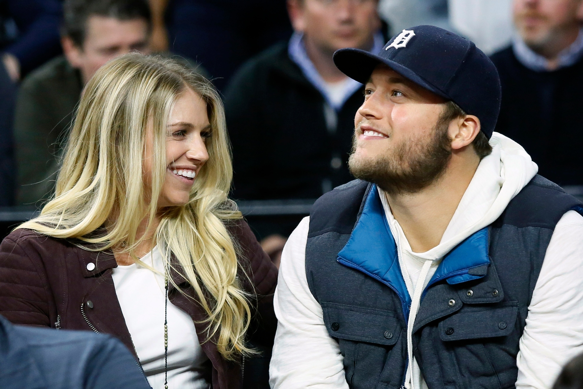 Matthew Stafford smiles while he watches the Detroit Pistons play the Cleveland Cavaliers with his wife Kelly,.