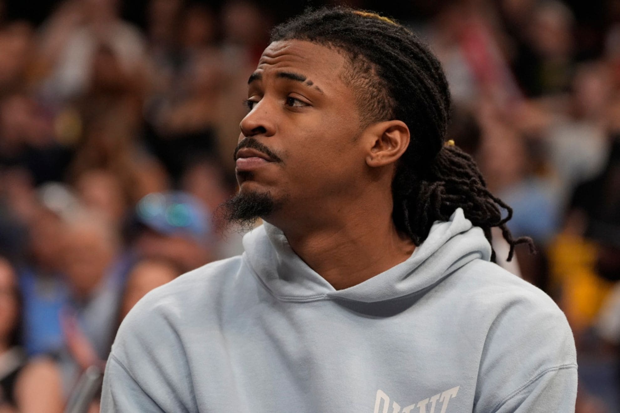 Memphis Grizzlies guard Ja Morant watches from the bench during the first half in Game 4 of an NBA basketball first-round playoff series against the Oklahoma City Thunder, Saturday, April 26, 2025, in Memphis, Tenn. (AP Photo/George Walker IV)