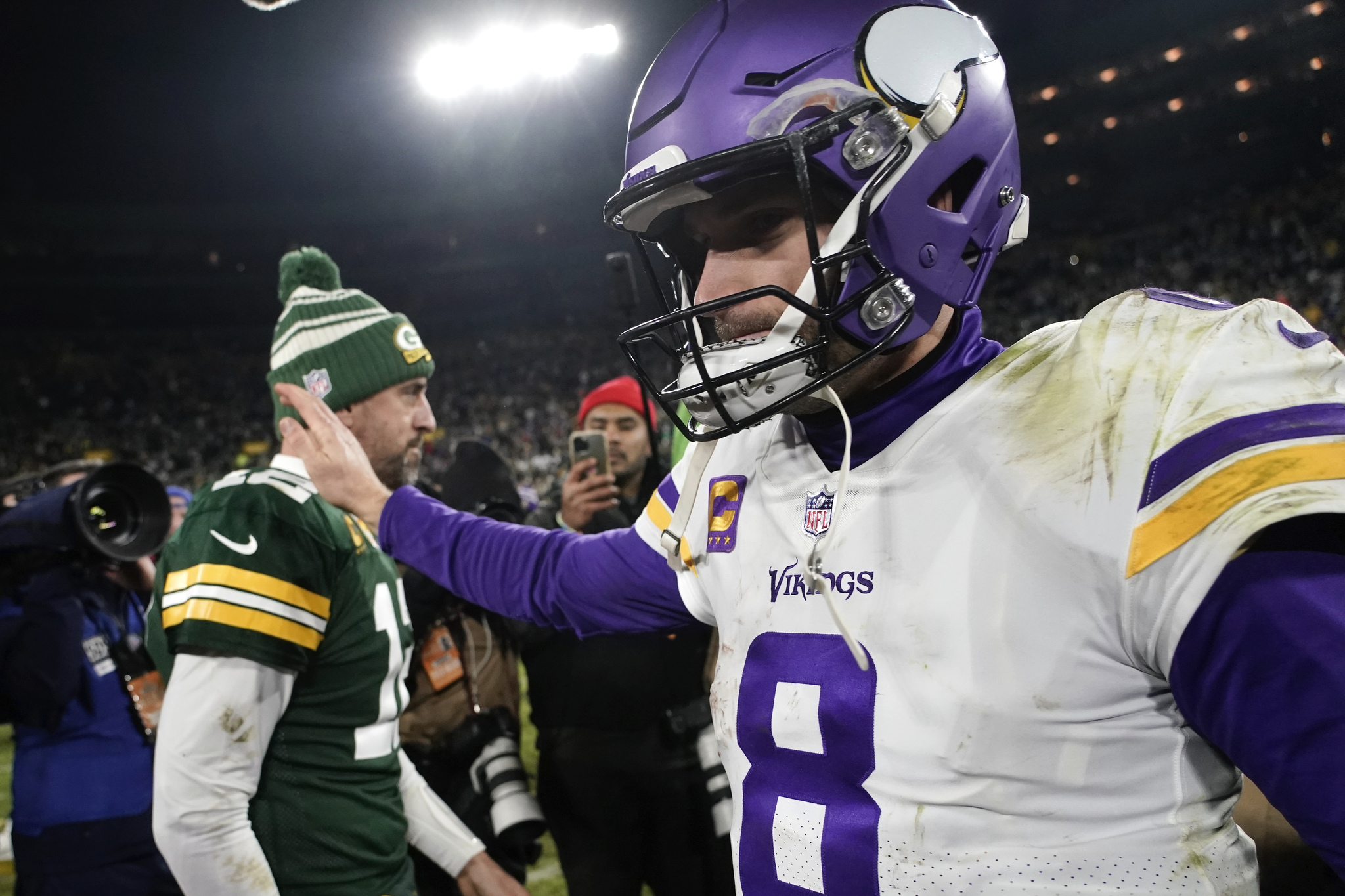 Minnesota Vikings quarterback Kirk Cousins (8) walks off the field ahead of Green Bay Packers quarterback Aaron Rodgers, Jan. 1, 2023