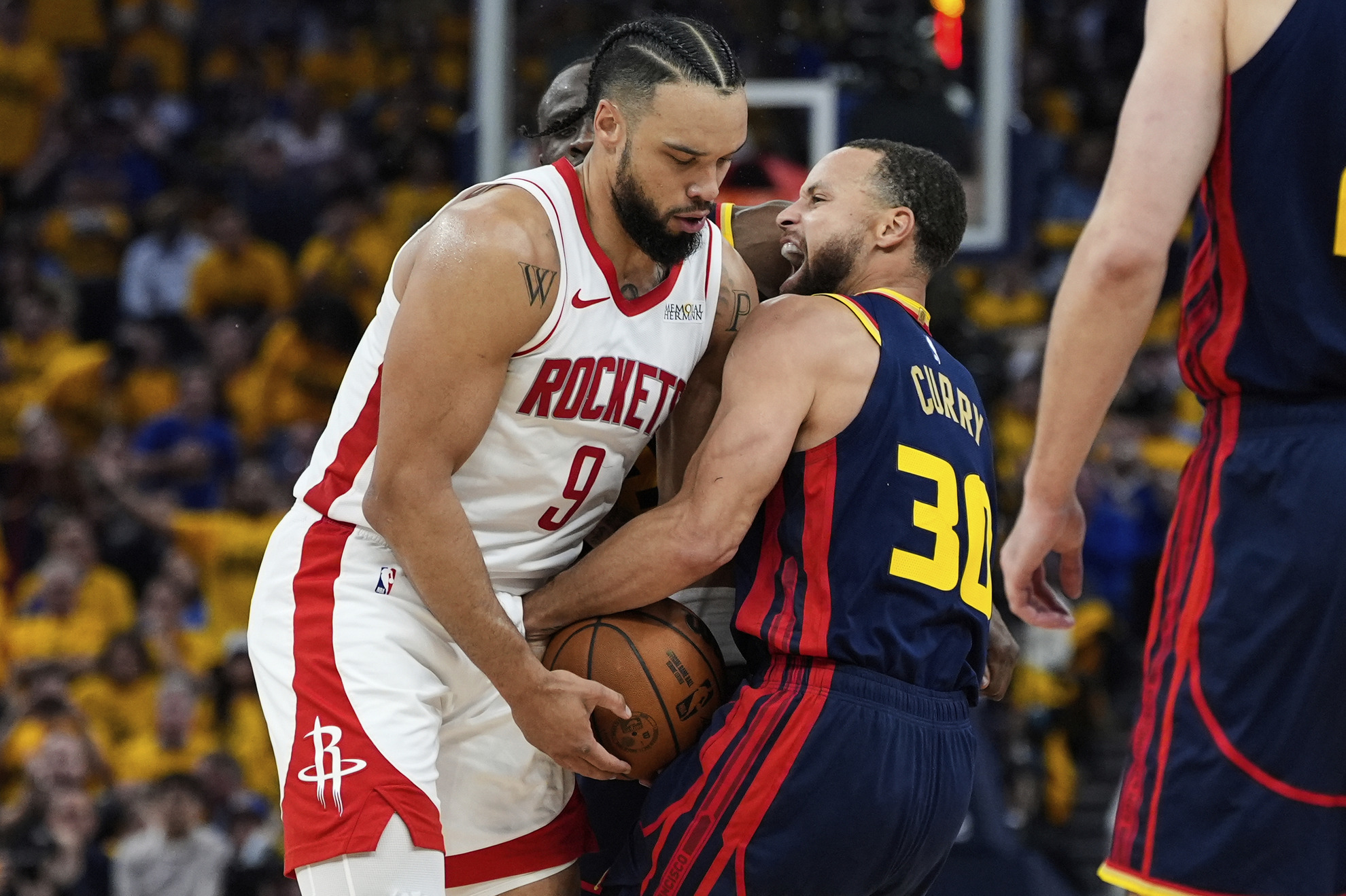 Golden State Warriors guard Stephen Curry confronts Houston Rockets forward Dillon Brooks