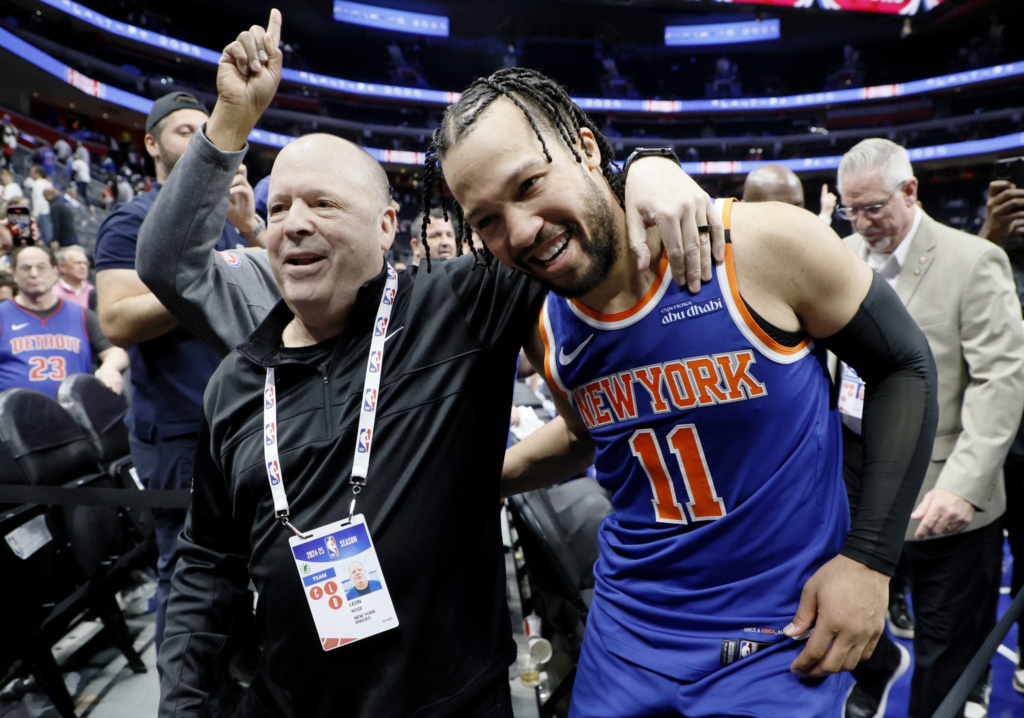 President of the New York Knicks Leon Rose, left, hugs guard Jalen Brunson (11) as they leave the court following a Game 6 win
