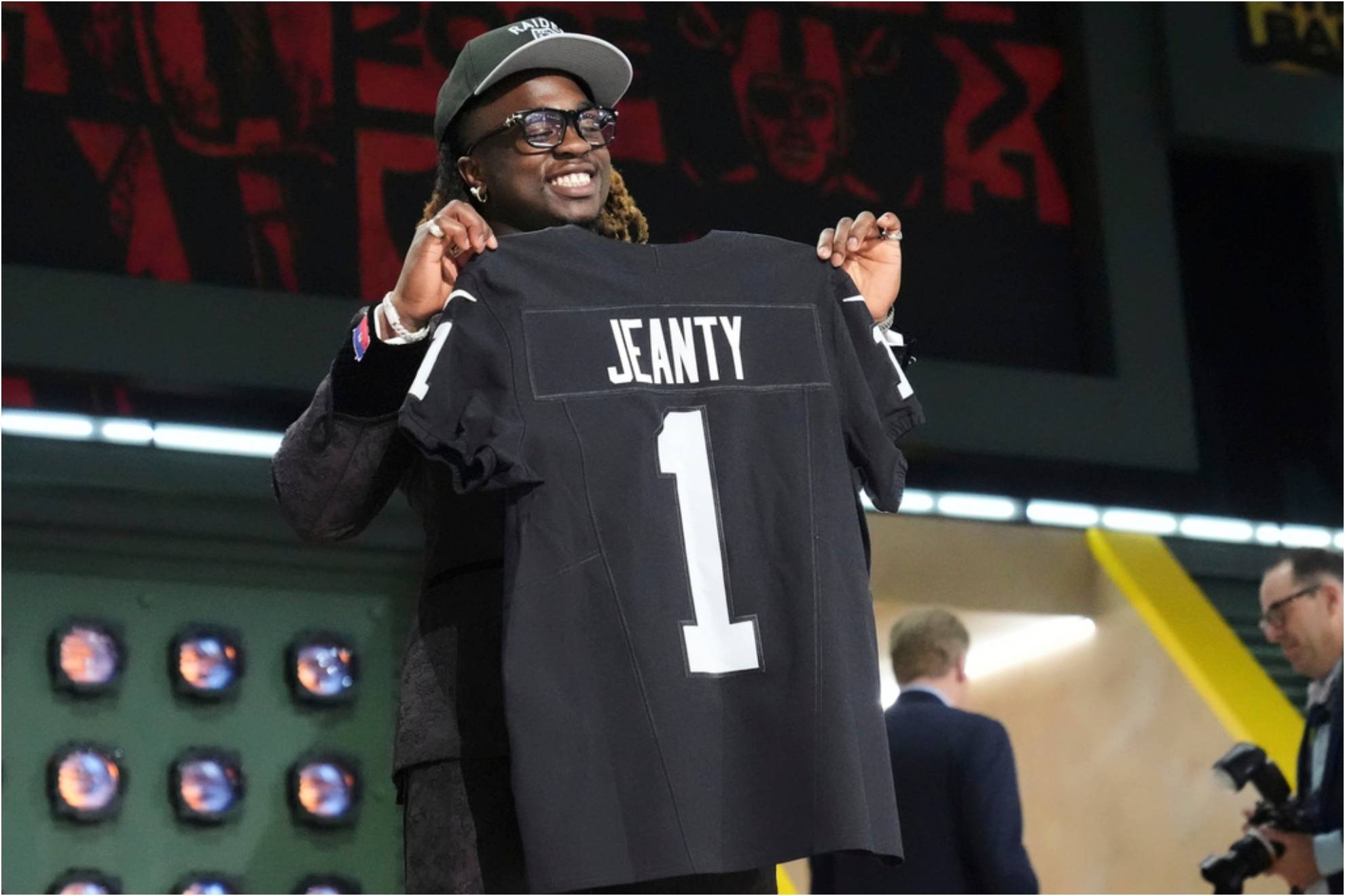 Boise State running back Ashton Jeanty poses after being chosen by the Las Vegas Raiders with the sixth overall pick.