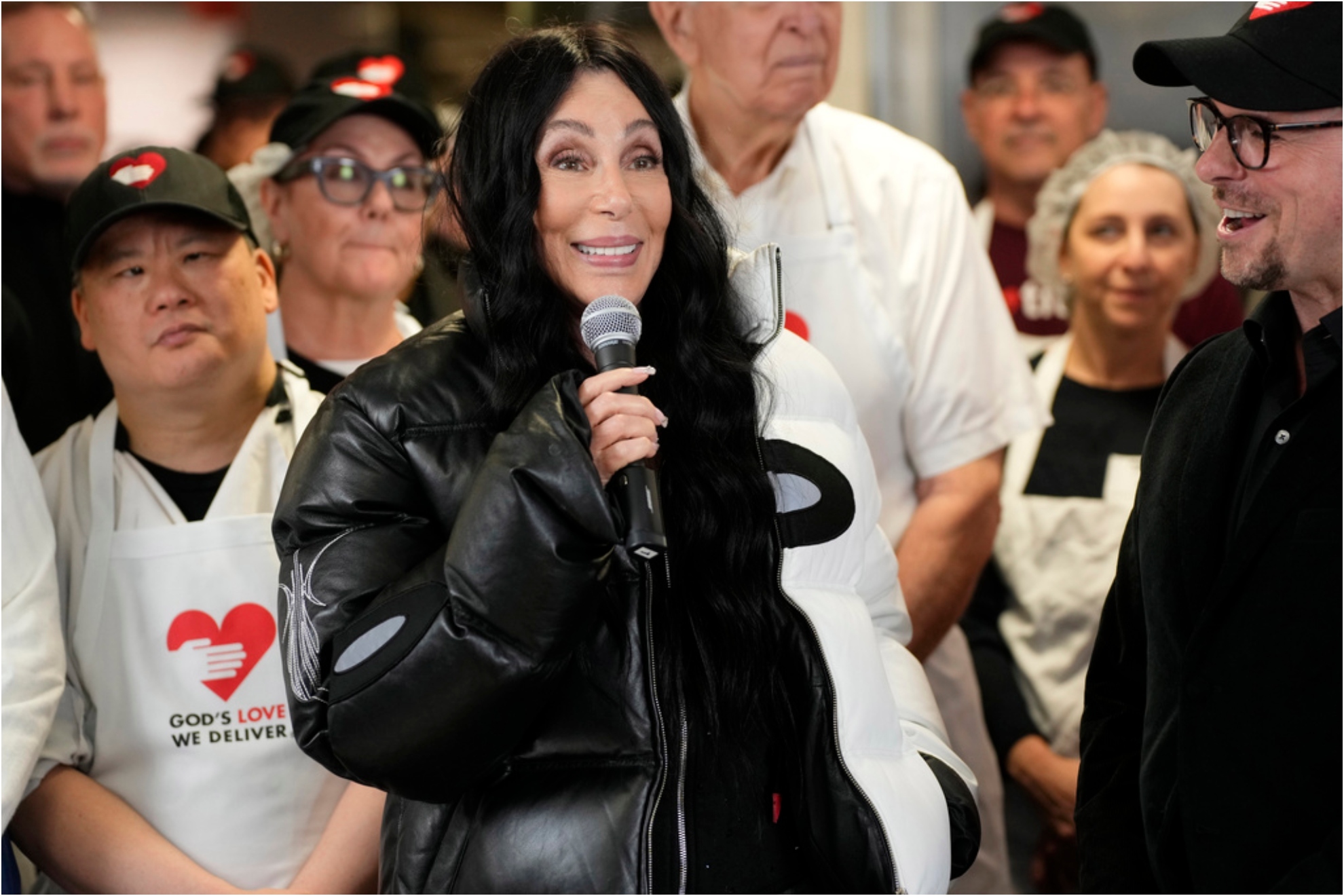 Cher visits the Gods Love We Deliver kitchen.