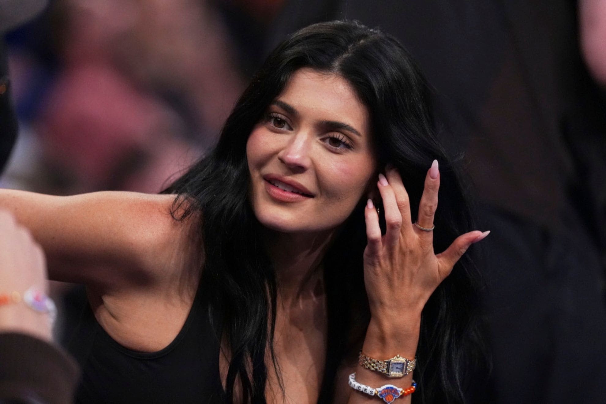 Kylie Jenner talks to colleagues during the second half of Game 4 in the Eastern Conference semifinals of the NBA basketball playoffs between the New York Knicks and the Boston Celtics Monday, May 12, 2025, in New York. (AP Photo/Frank Franklin II)