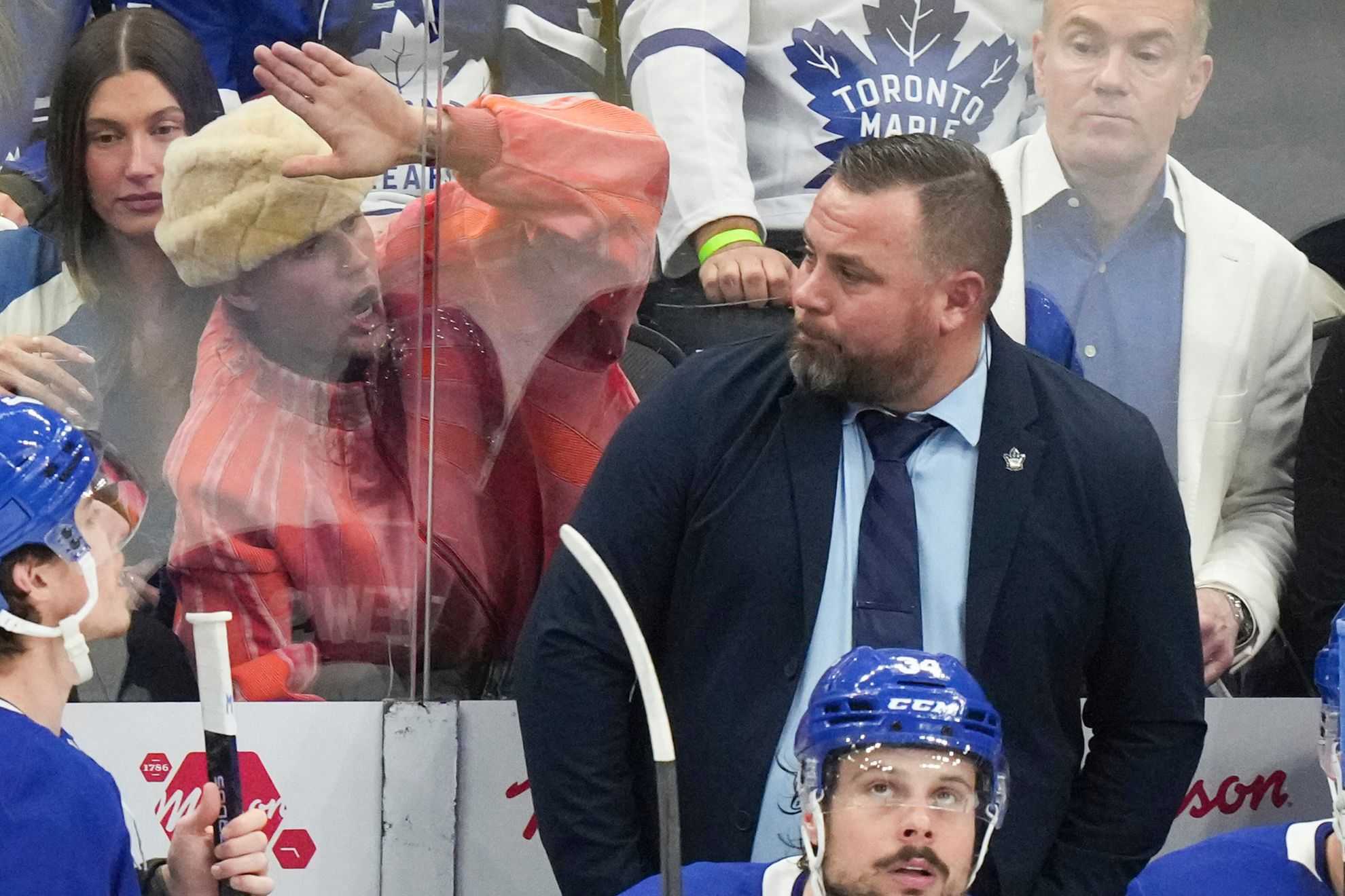 Justin Bieber and Hailey Bieber are defeated by sleep during a boring hockey game