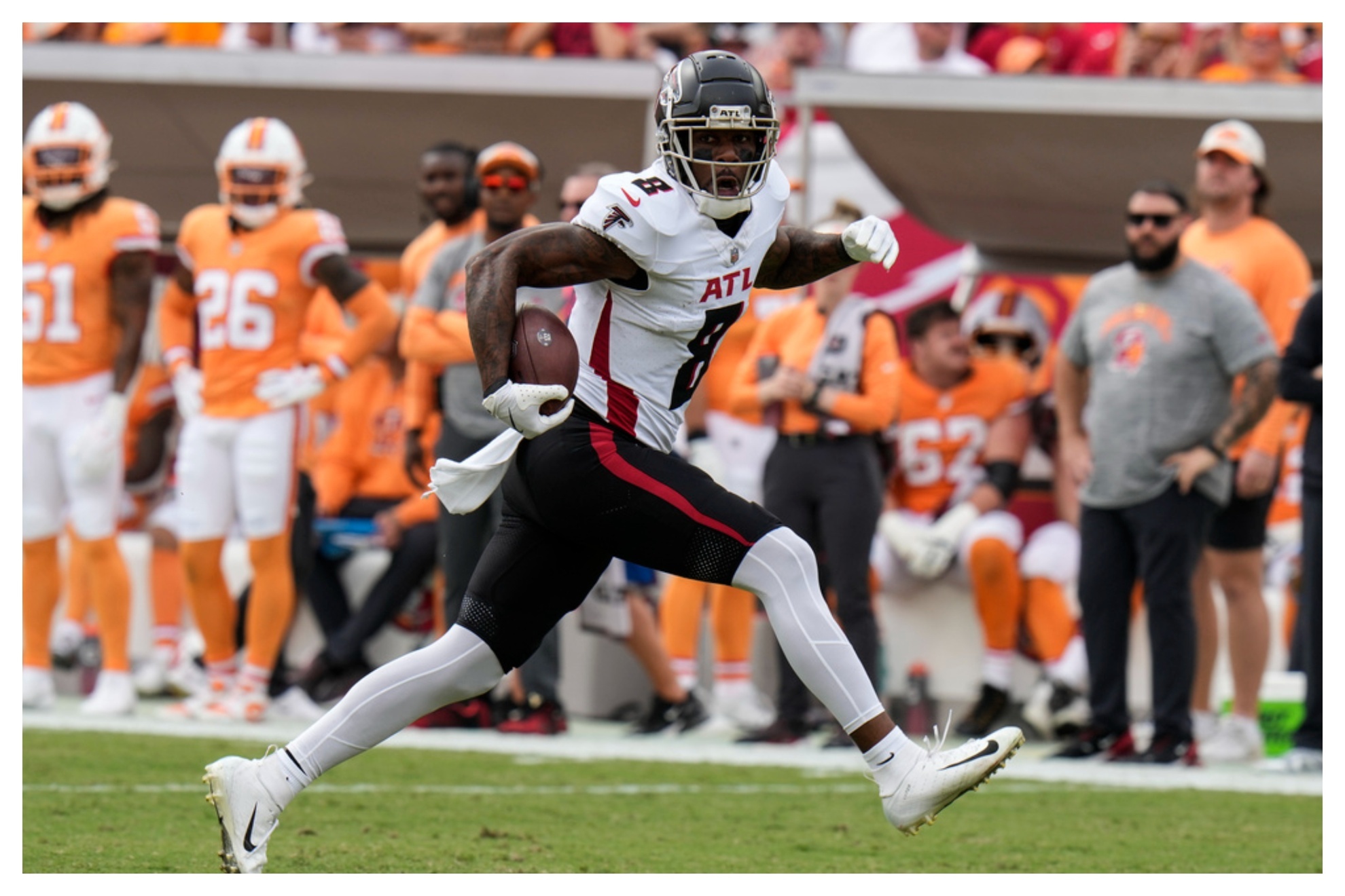 Atlanta Falcons tight end Kyle Pitts (8) runs after a catch for a touchdown against the Tampa Bay Buccaneers during the first half of an NFL football game.