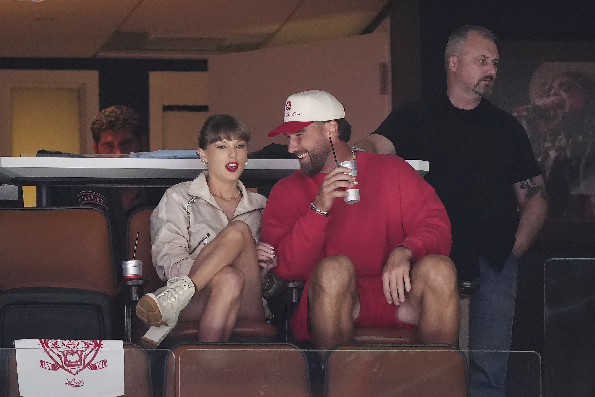Singer Taylor Swift, front left, and Kansas City Chiefs football player Travis Kelce, front right, take in the third period in Game 4 of the NHL hockey Stanley Cup Final between the Edmonton Oilers and the Florida Panthers in Sunrise, Fla., Thursday, June 12, 2025. (Nathan Denette/The Canadian Press via AP)