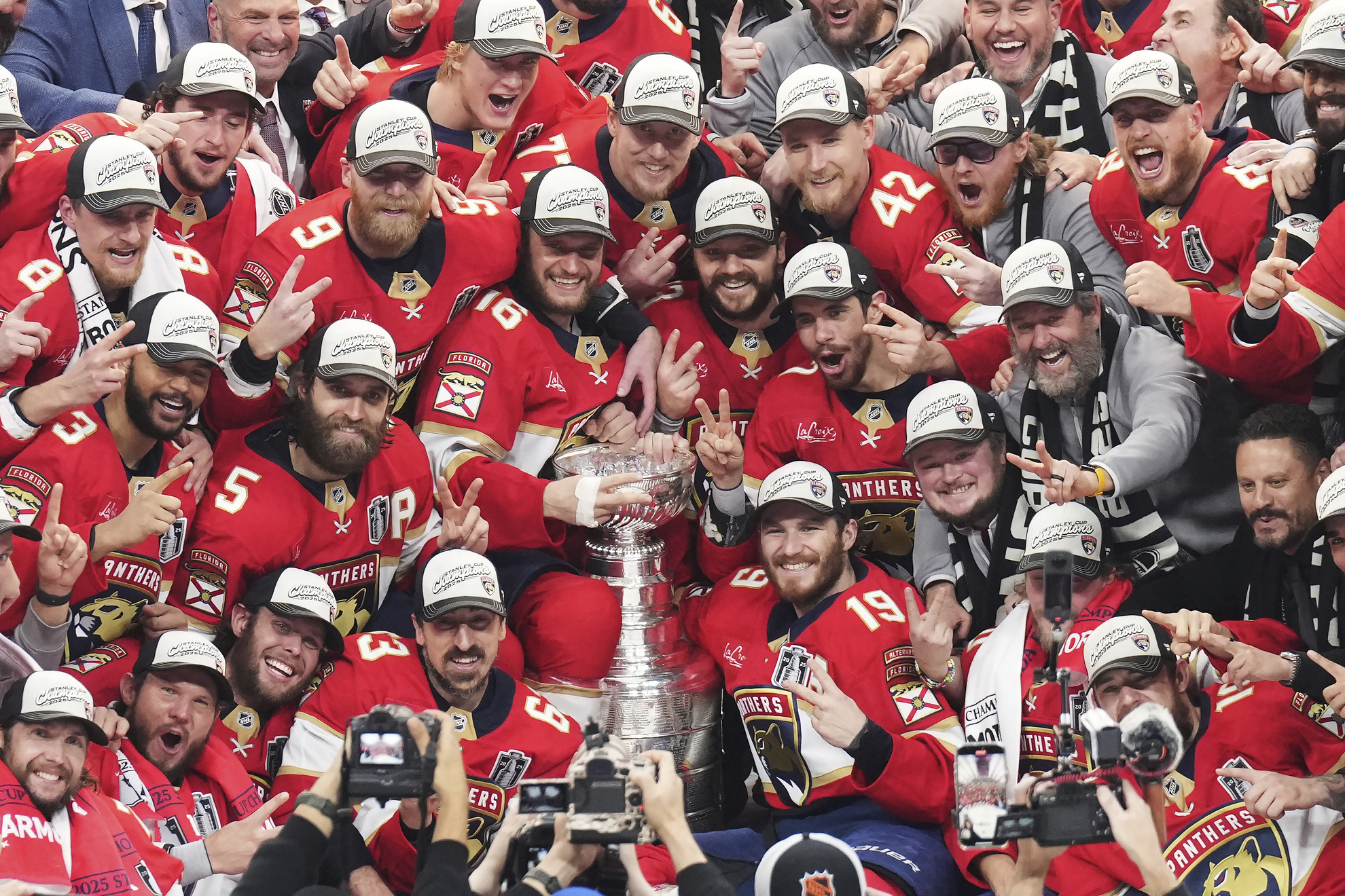 The Florida Panthers celebrate with the Stanley Cup after defeating the Edmonton Oilers in Game 6
