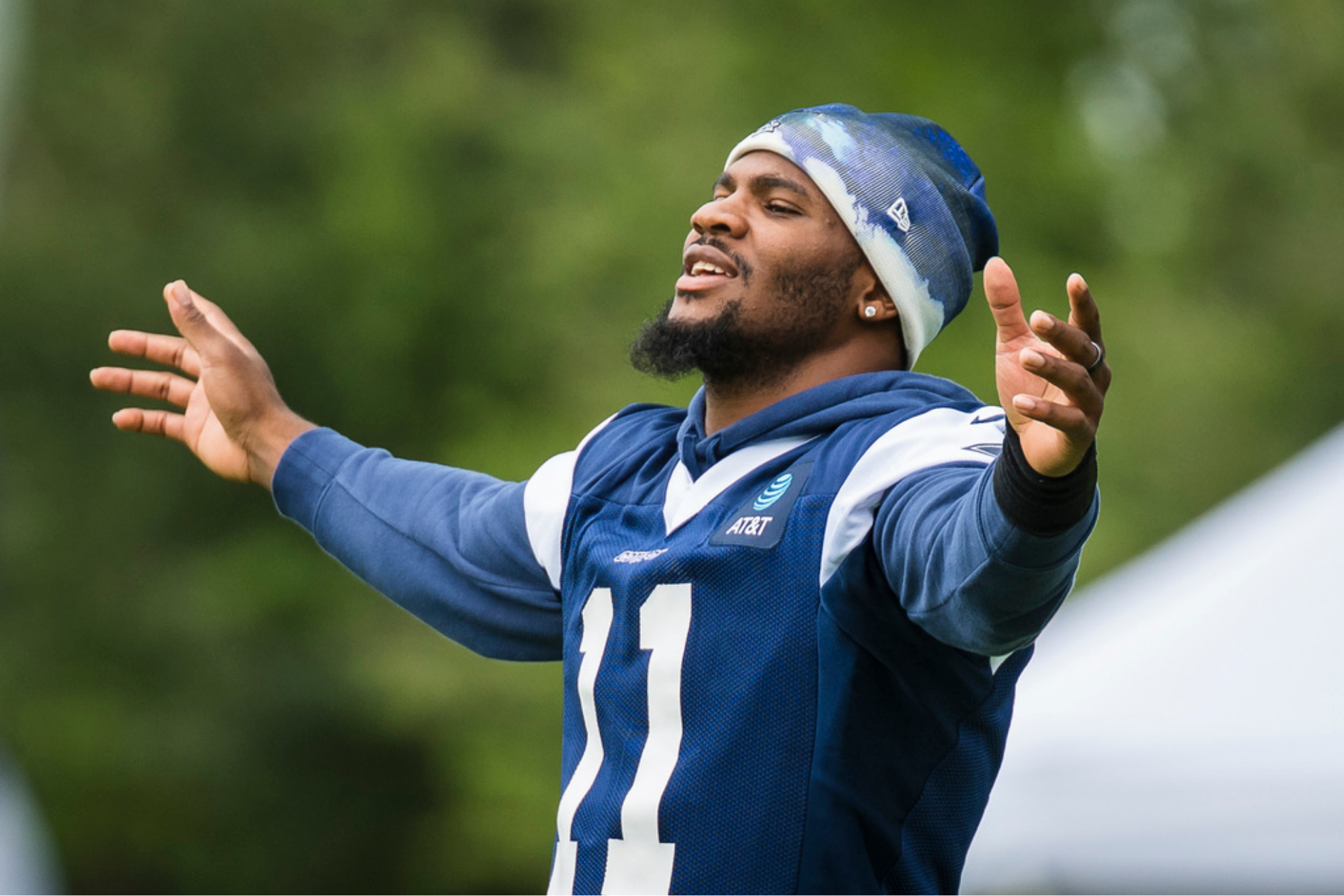 Dallas Cowboys Micah Parsons gestures during practice at NF