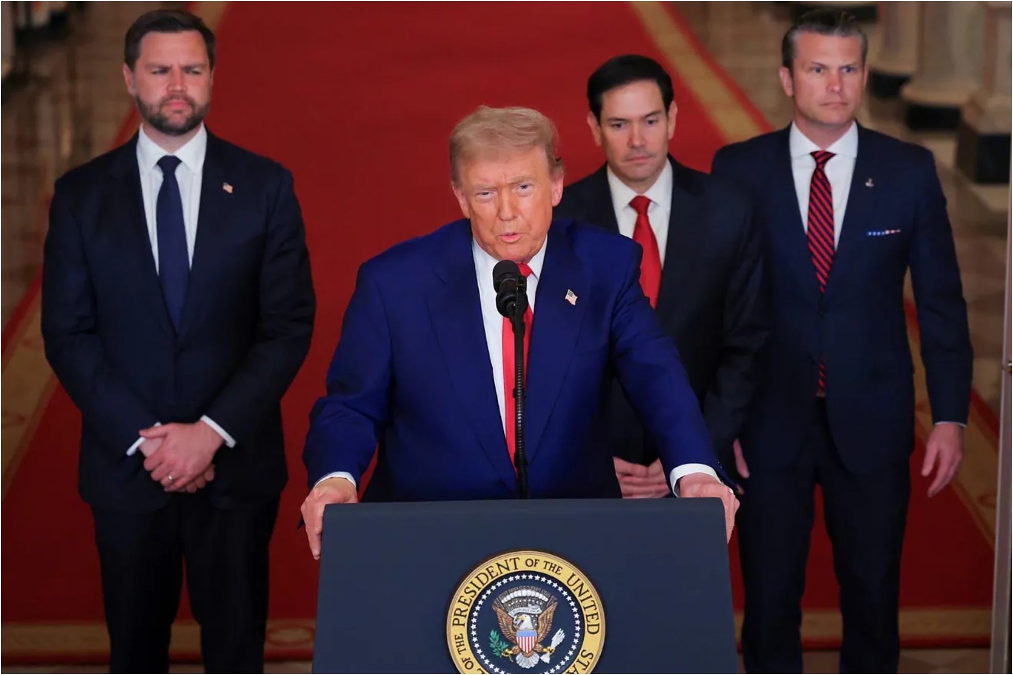 President Donald Trump speaks from the White House as Vice President JD Vance, Secretary of State Marco Rubio and Secretary of Defense Pete Hegseth listen.