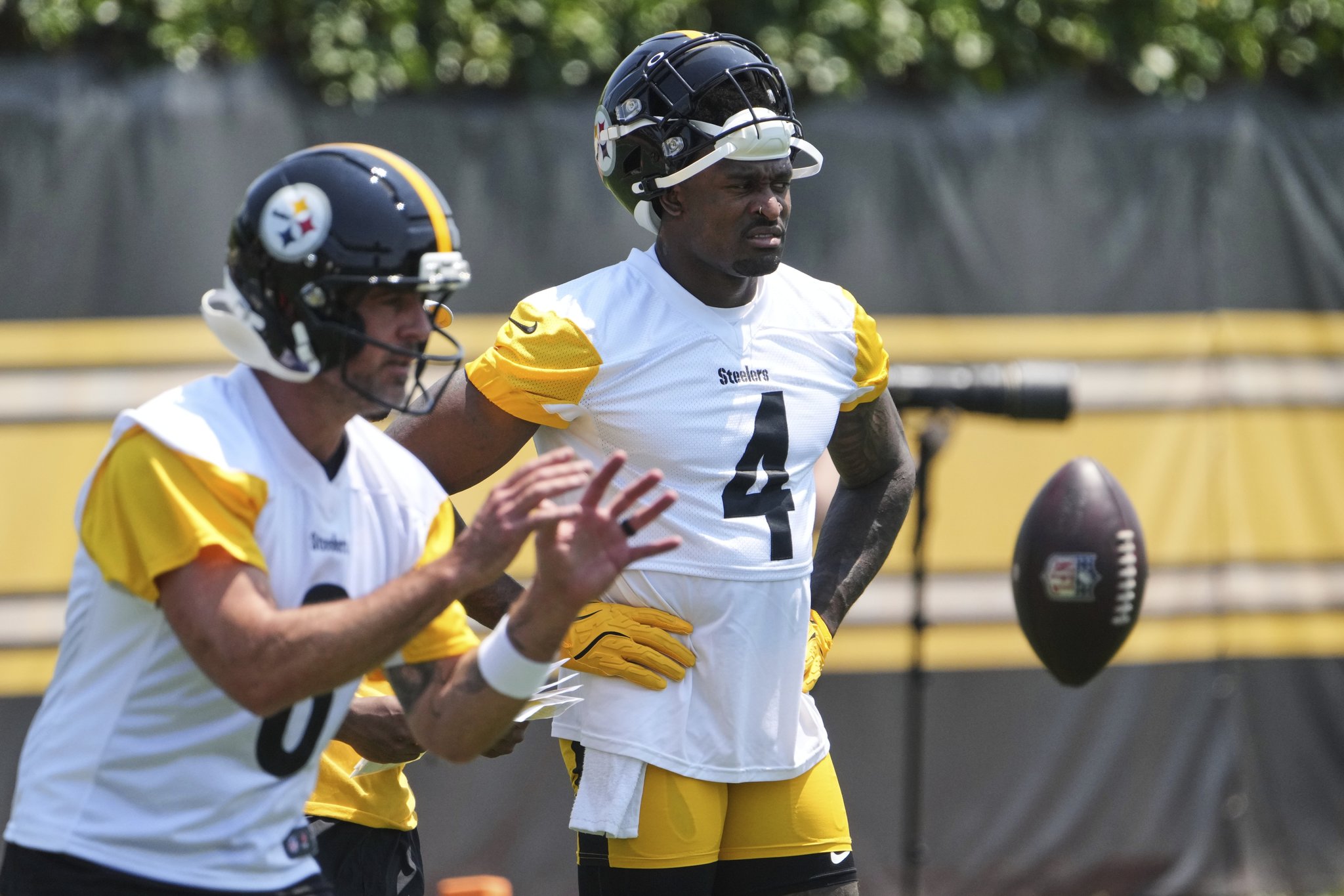 Pittsburgh Steelers wide receiver DK Metcalf (4) waits his turn as quarterback Aaron Rodgers takes a snap during practice