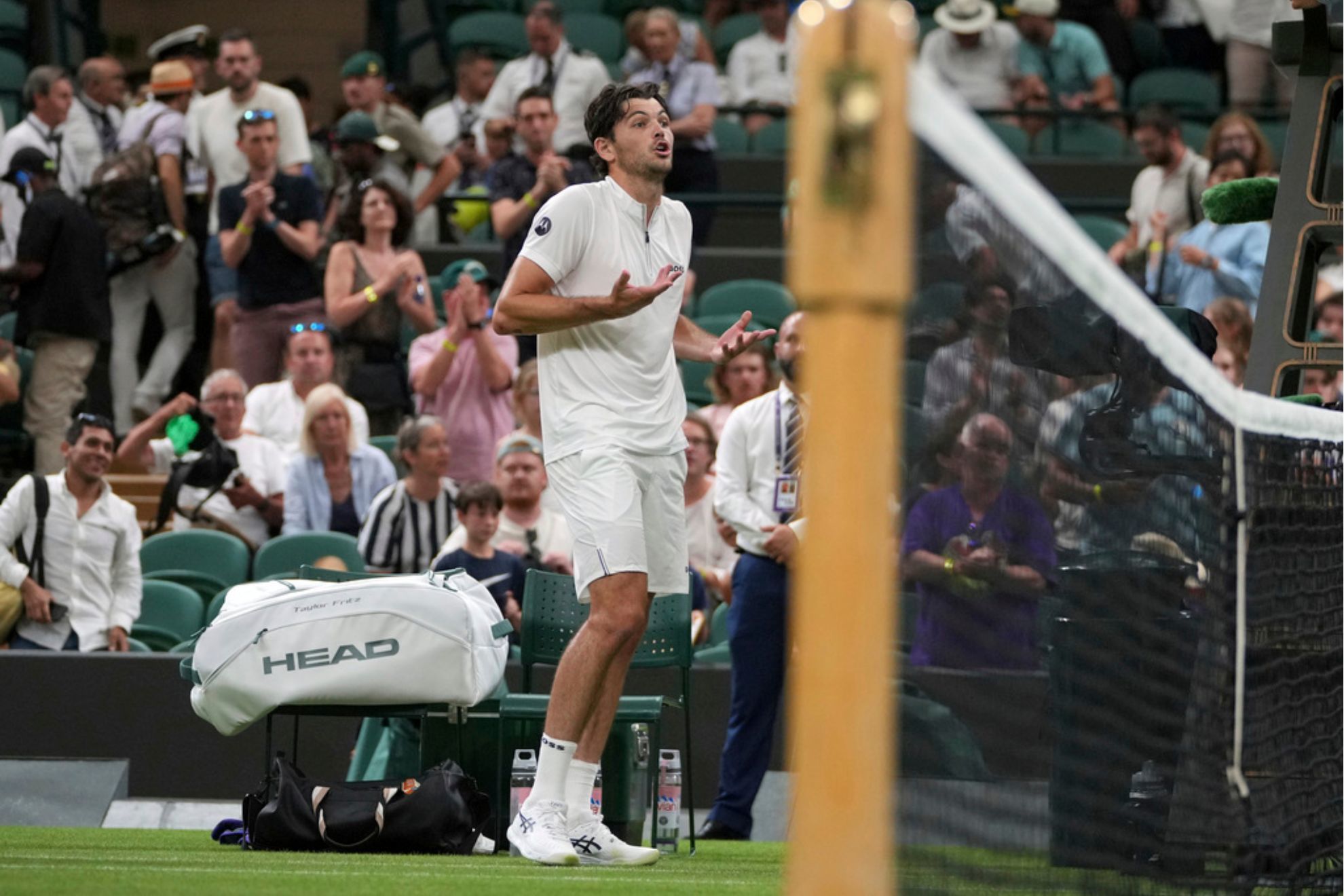 Taylor Fritz of the U.S. reacts after the first round mens single match against Giovanni Mpetshi Perricard of France was suspended at the Wimbledon Tennis Championships in London