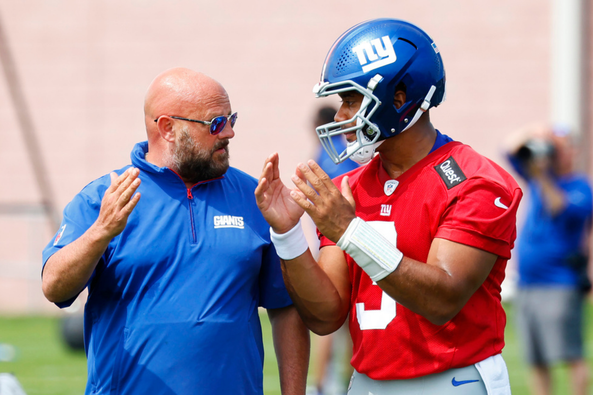 New York Giants head coach Brian Daboll, left, talks to quarterback Russell Wilson, right