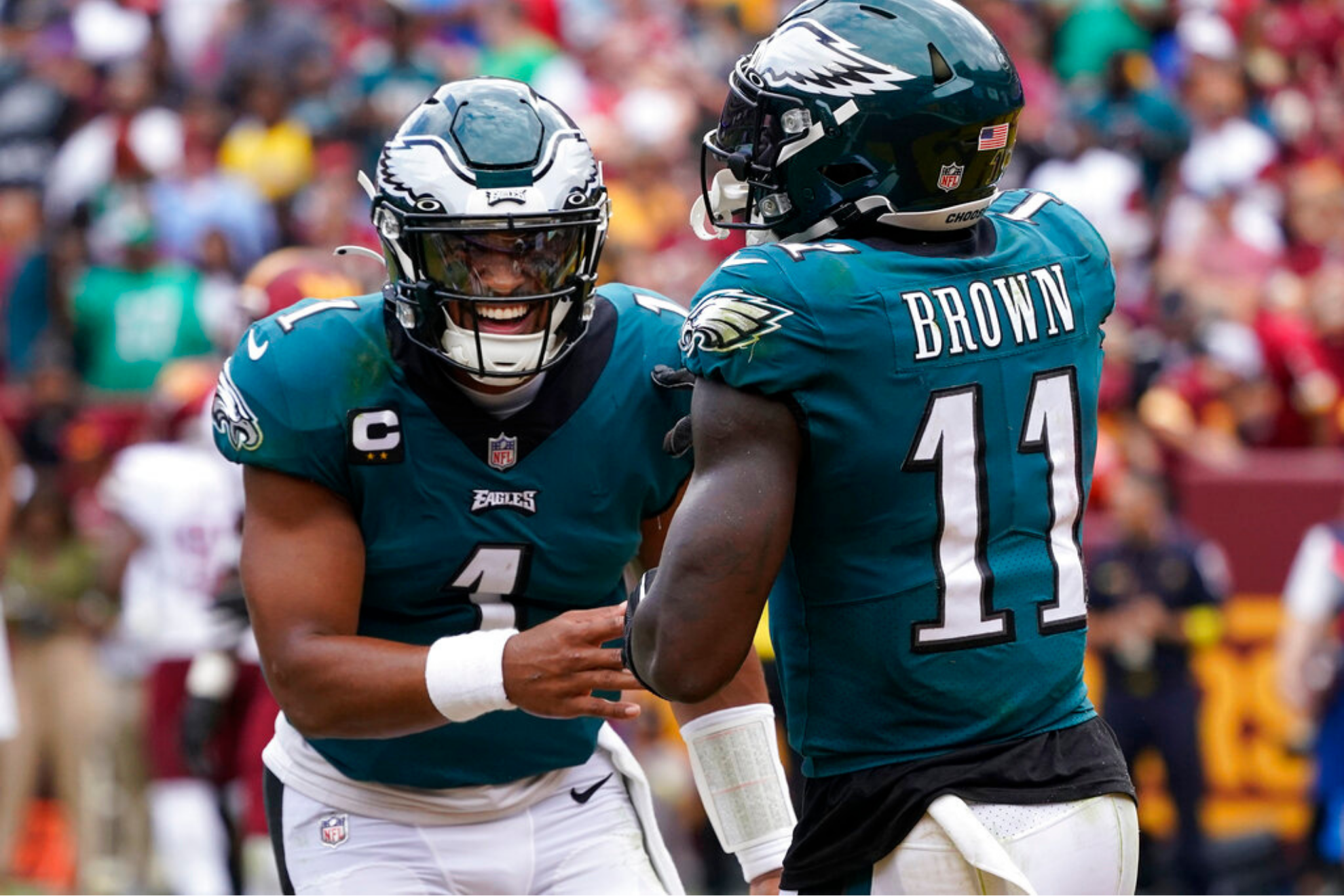 Philadelphia Eagles wide receiver A.J. Brown and quarterback Jalen Hurts celebrating their touchdown