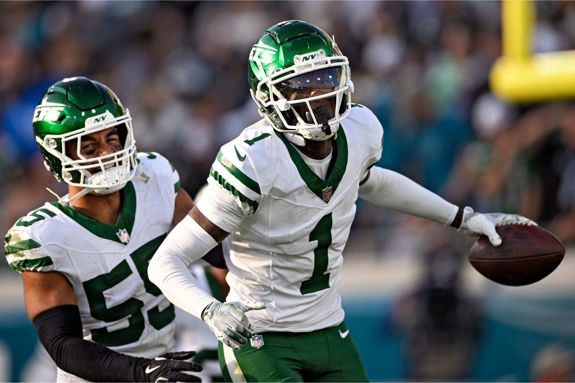 New York Jets cornerback Sauce Gardner celebrates with linebacker Chazz Surratt after Gardner intercepted a pass against the Jacksonville Jaguars