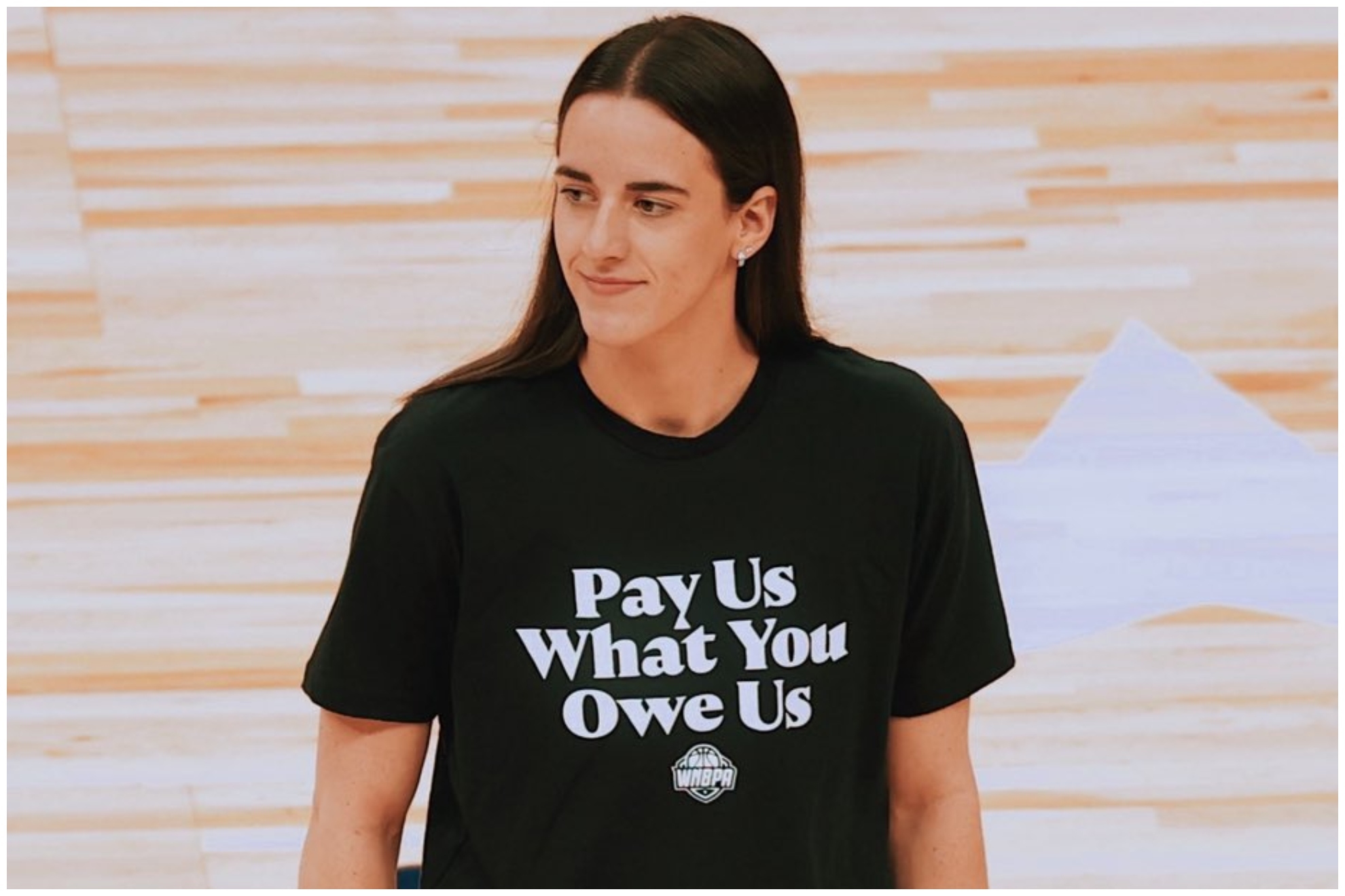Caitlin Clark wearing the Pay Us What You Owe Us, shirt