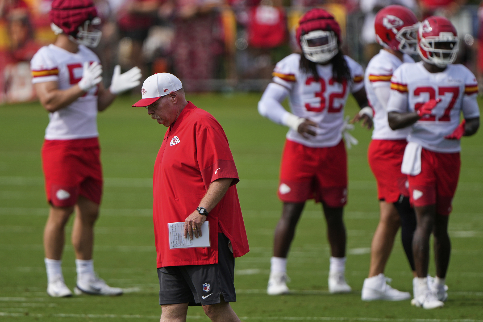 Kansas City Chiefs head coach Andy Reid walks between drills at NFL football training camp Tuesday, July 22, 2025, in St. Joseph, Mo. (AP Photo/Charlie Riedel)