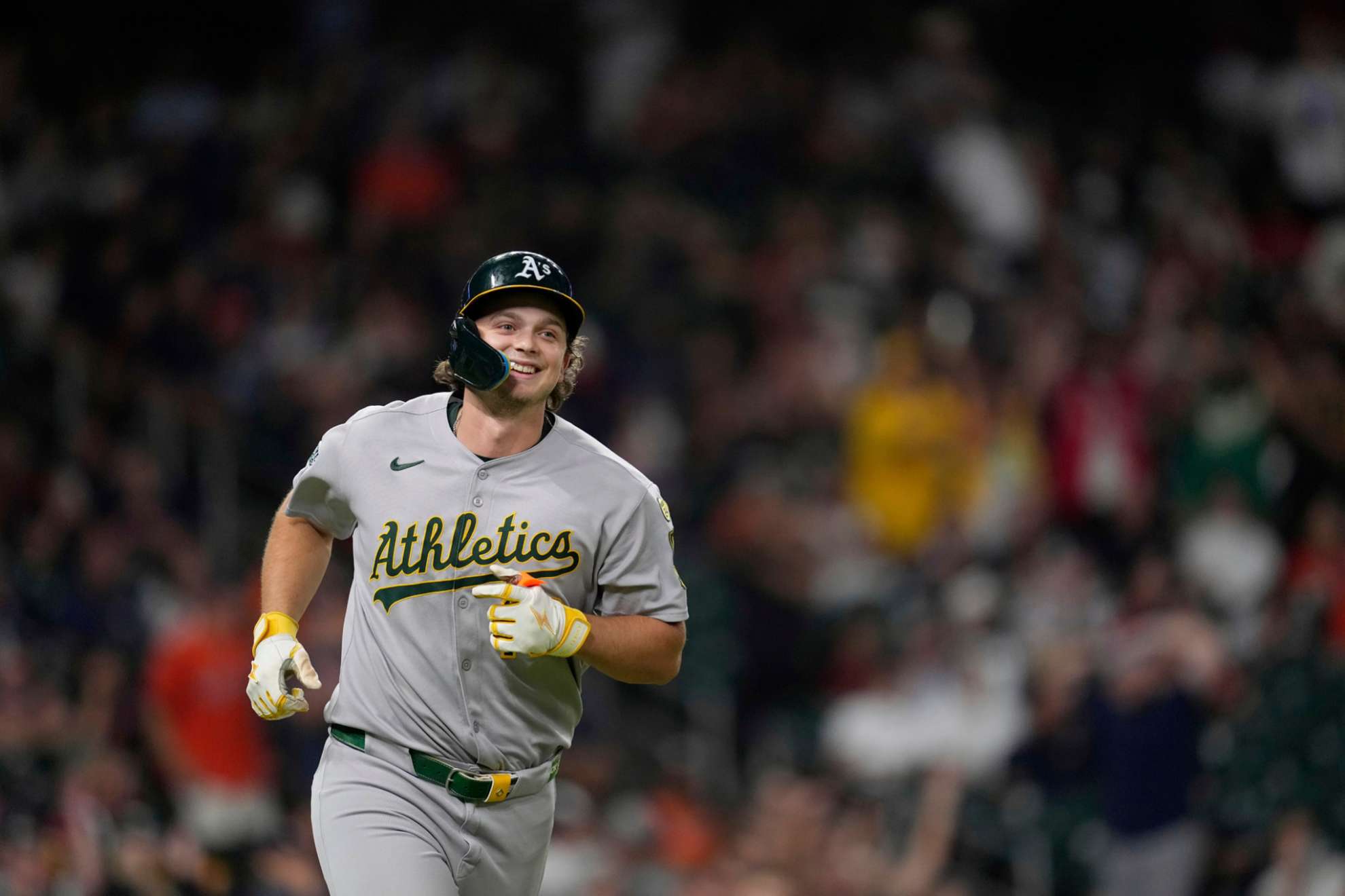 Athletics' Nick Kurtz smiles after hitting a three-run home against the Houston Astros during the ninth inning of a baseball game Friday, July 25, 2025, in Houston. (AP Photo/David J. Phillip)