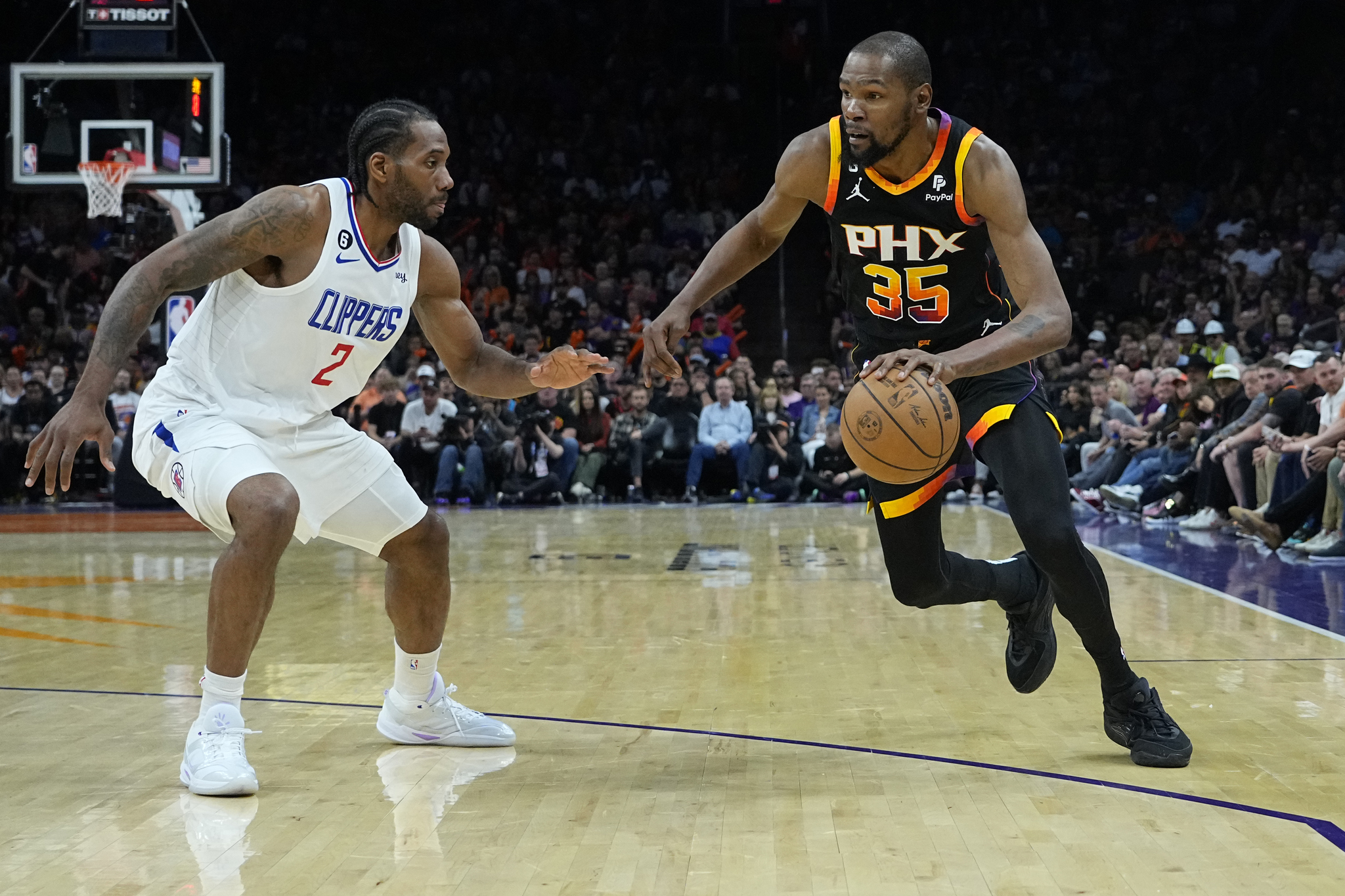 Former Suns forward Kevin Durant (35) drives on Los Angeles Clippers forward Kawhi Leonard (2) during Game 2 of a first-round NBA basketball playoff series