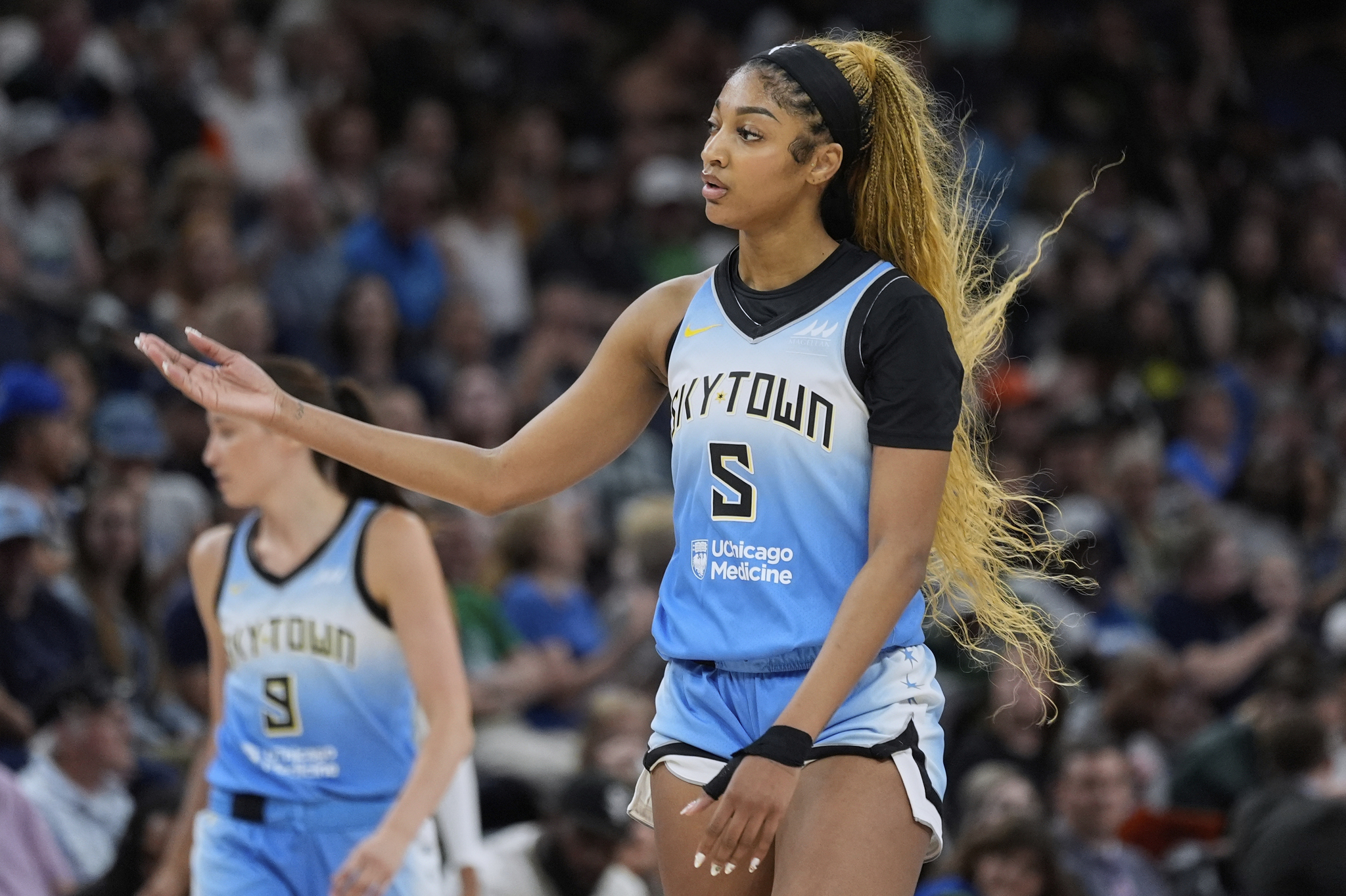 Chicago Sky forward Angel Reese (5) reacts after receiving a traveling violation during a WNBA game against the Minnesota Lynx