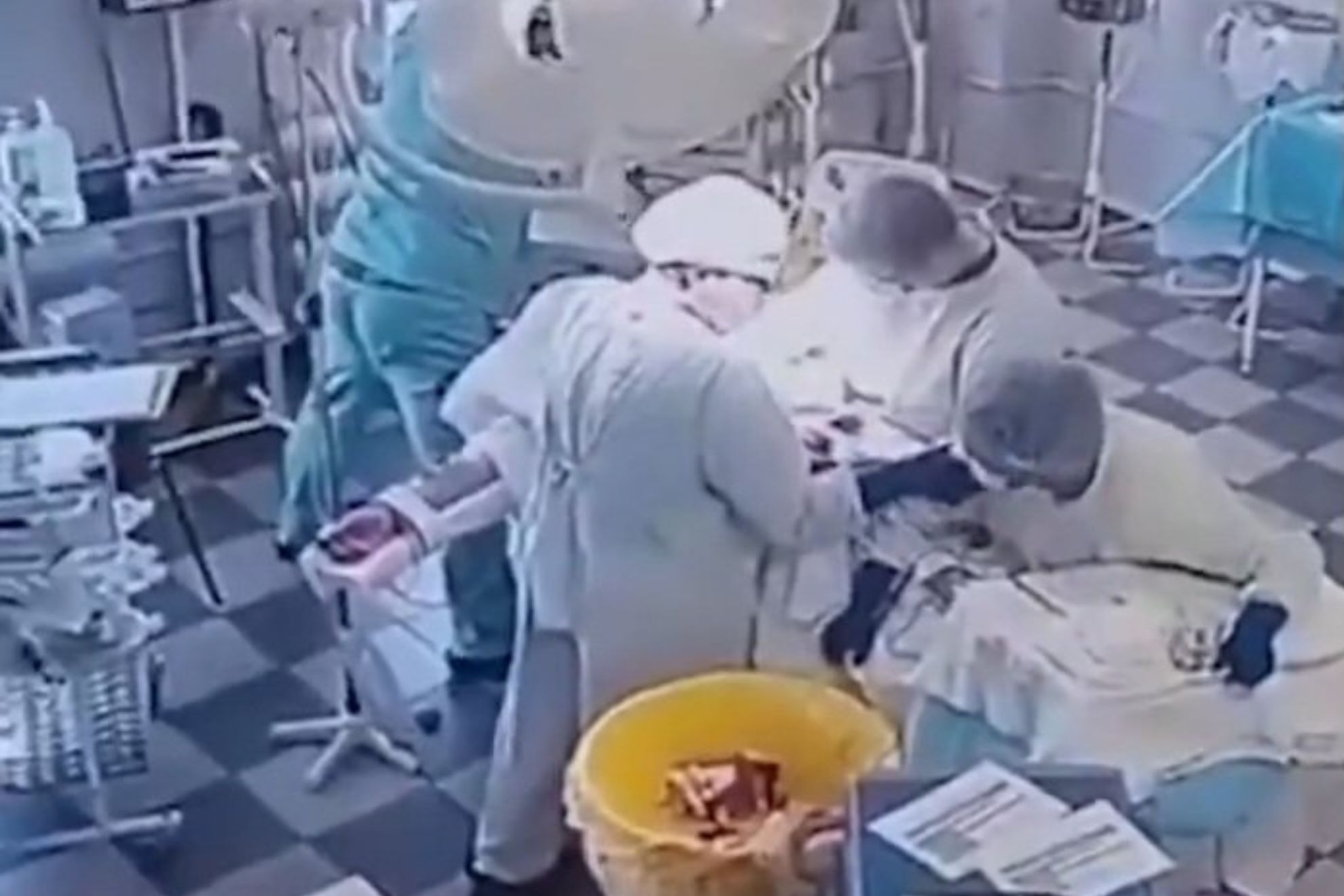 The jaw-dropping footage shows surgeons calmly working through chaos