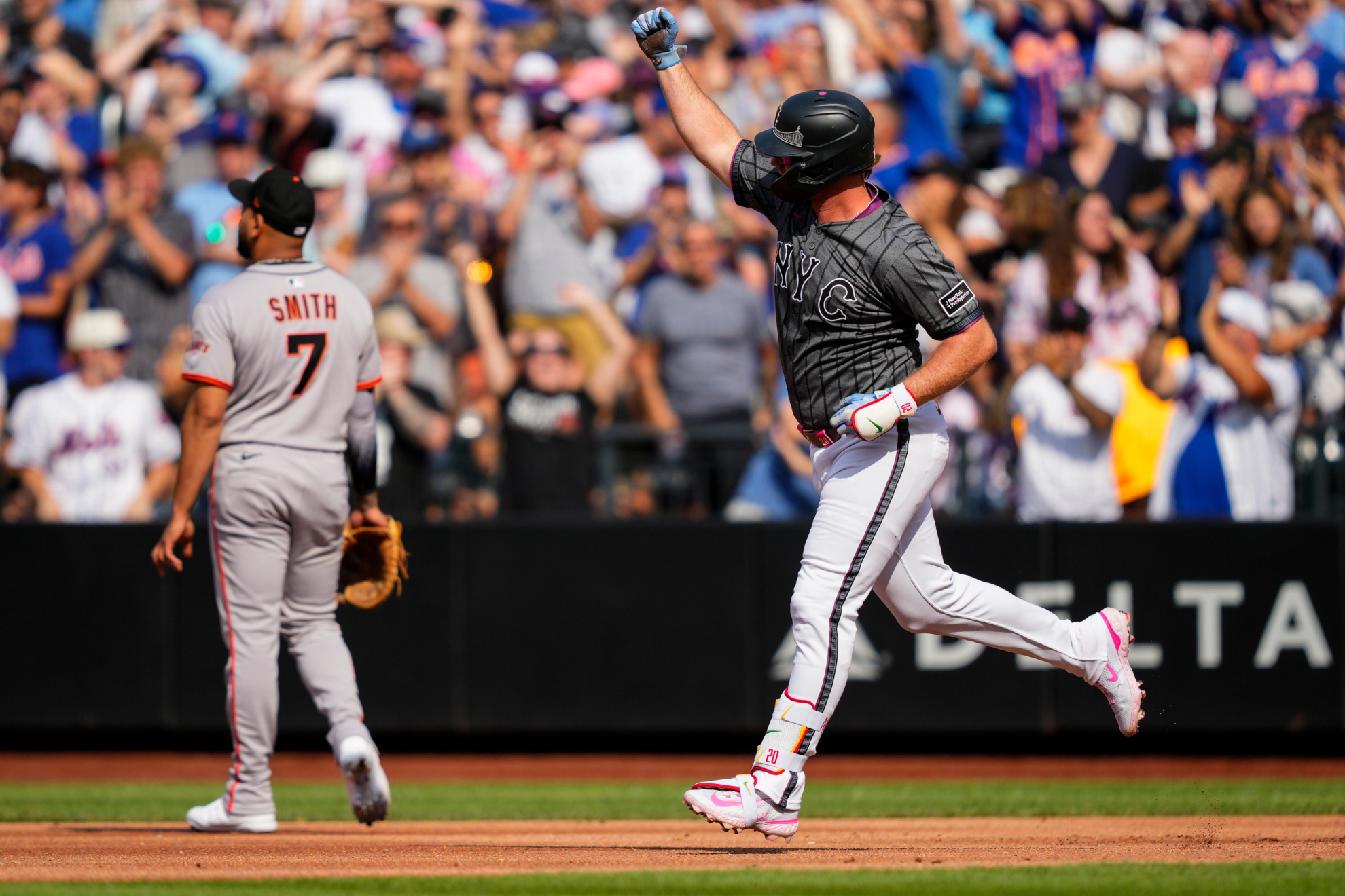 New York Mets Pete Alonso, right, celebrates after hitting a two-run home run during the first inning of a baseball game against the San Francisco Giants, Saturday, Aug. 2, 2025, in New York.