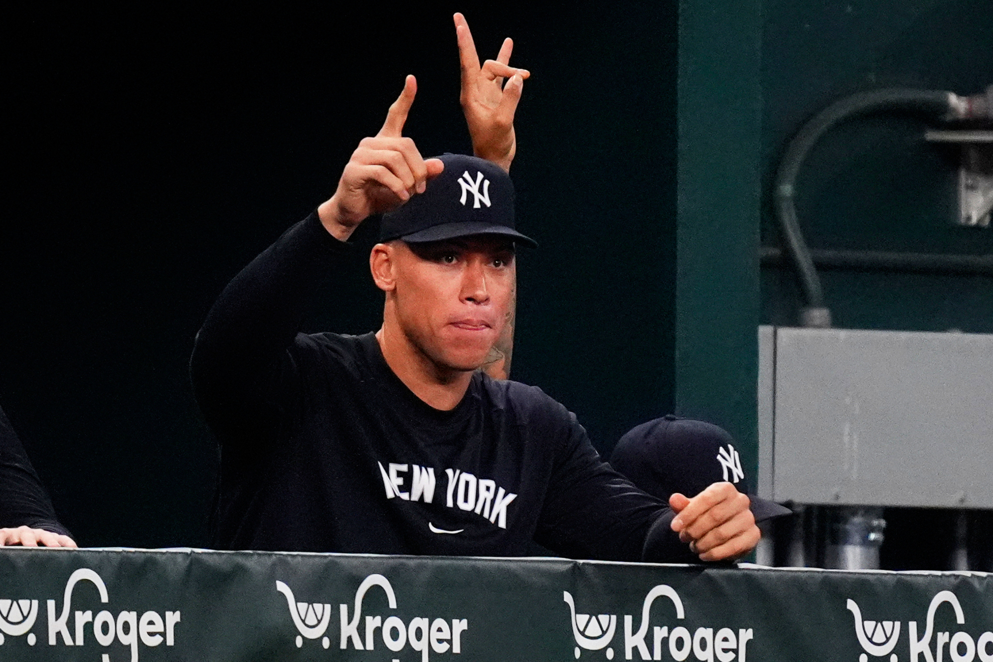 New York Yankees Aaron Judge gestures in the dugout during the second inning of a baseball game against the Texas Rangers, Monday, Aug. 4, 2025, in Arlington, Texas.