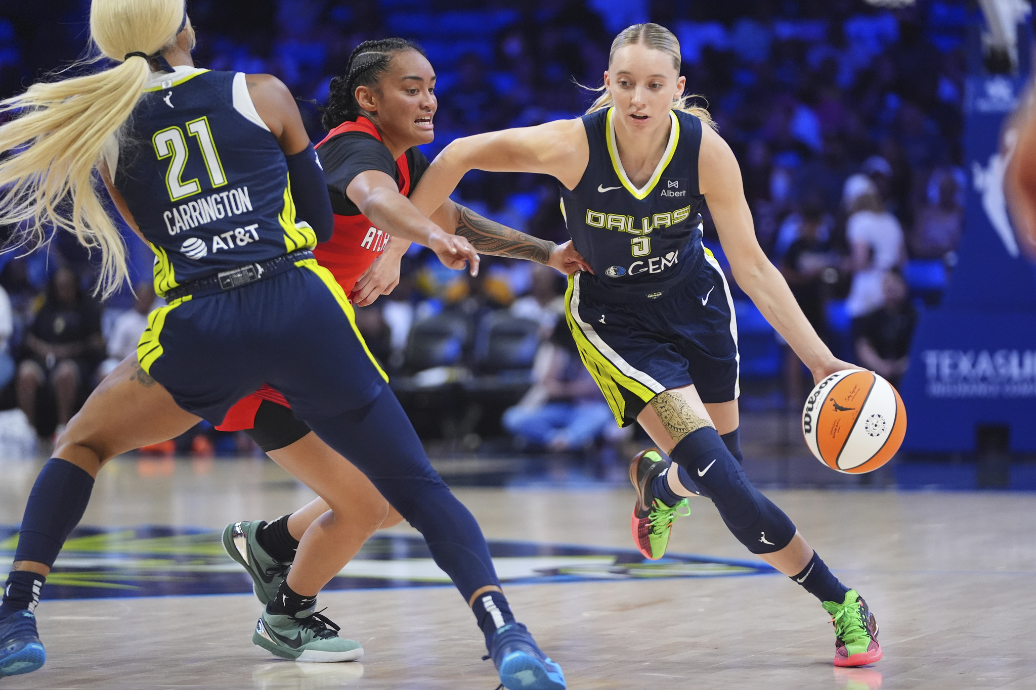 Dallas Wings guard Paige Bueckers (5) uses a screen by teammate guard DiJonai Carrington (21) against Atlanta Dream