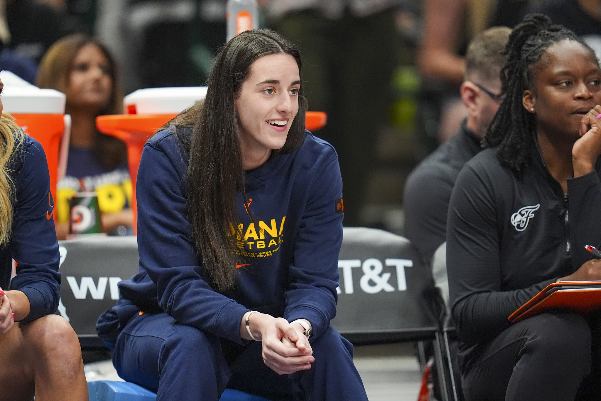 Indiana Fever guard Caitlin Clark looks on from the bench during a WNBA game against the Dallas Wings