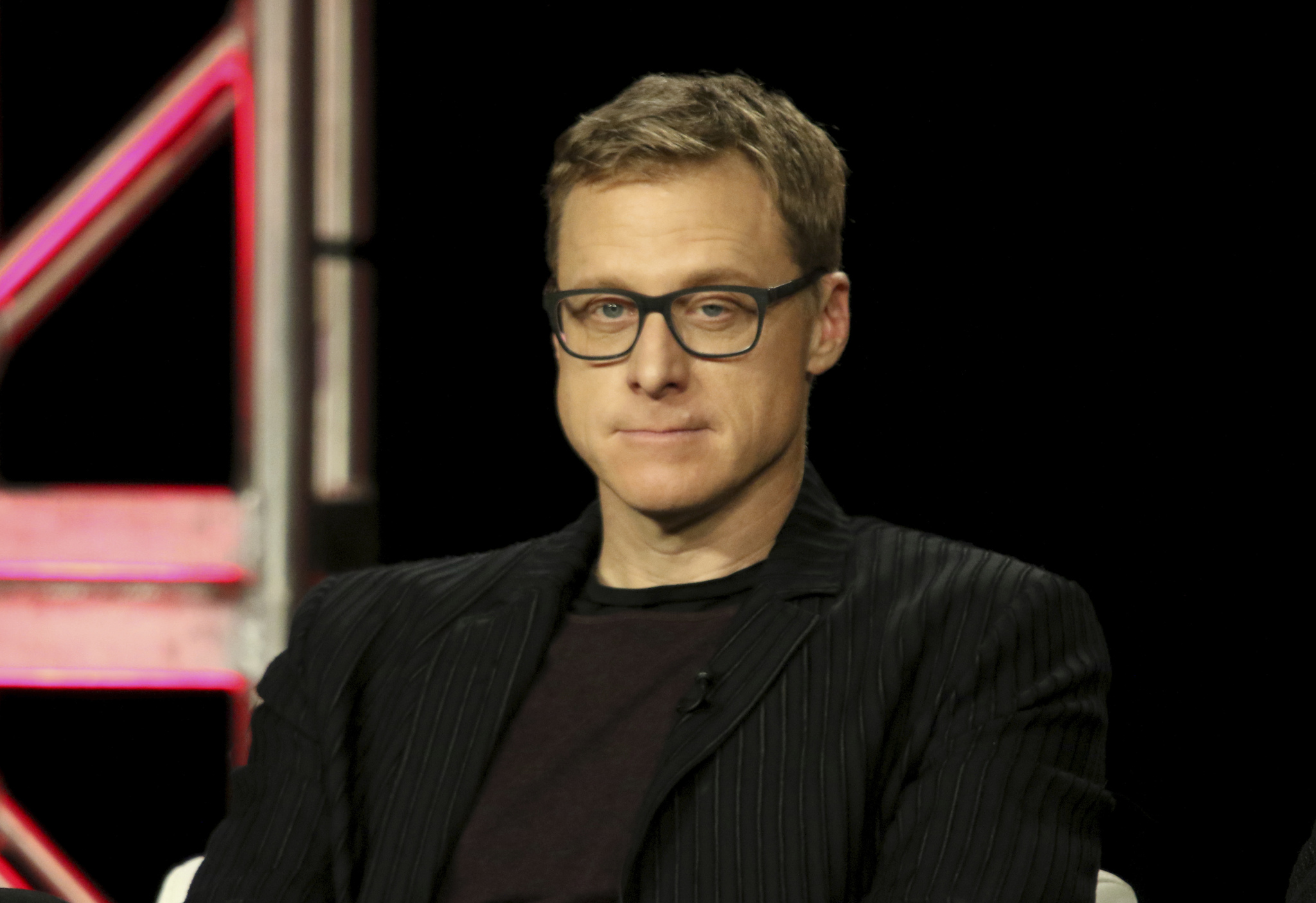 Why was Alan Tudyk dropped from the I, Robot press schedule?