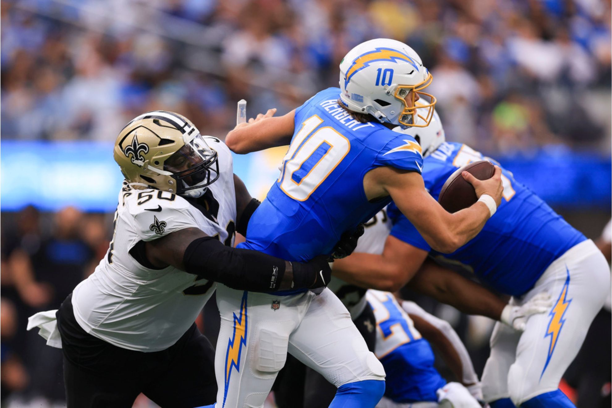 New Orleans Saints defensive tackle Khalen Saunders sacks Los Angeles Chargers quarterback Justin Herbert in the second half of an NFL football game