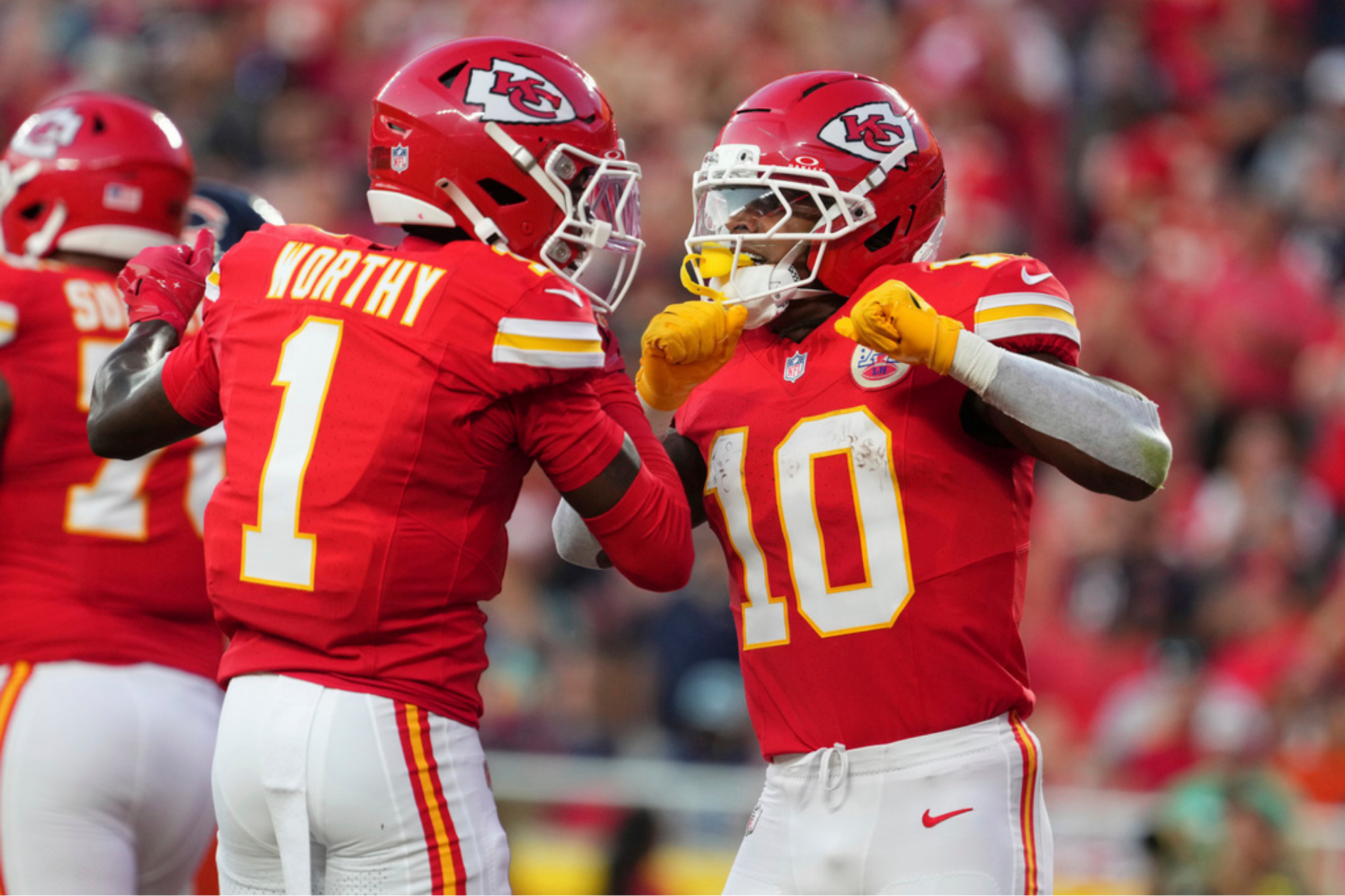 Kansas City Chiefs running back Isiah Pacheco is congratulated by teammate Xavier Worthy