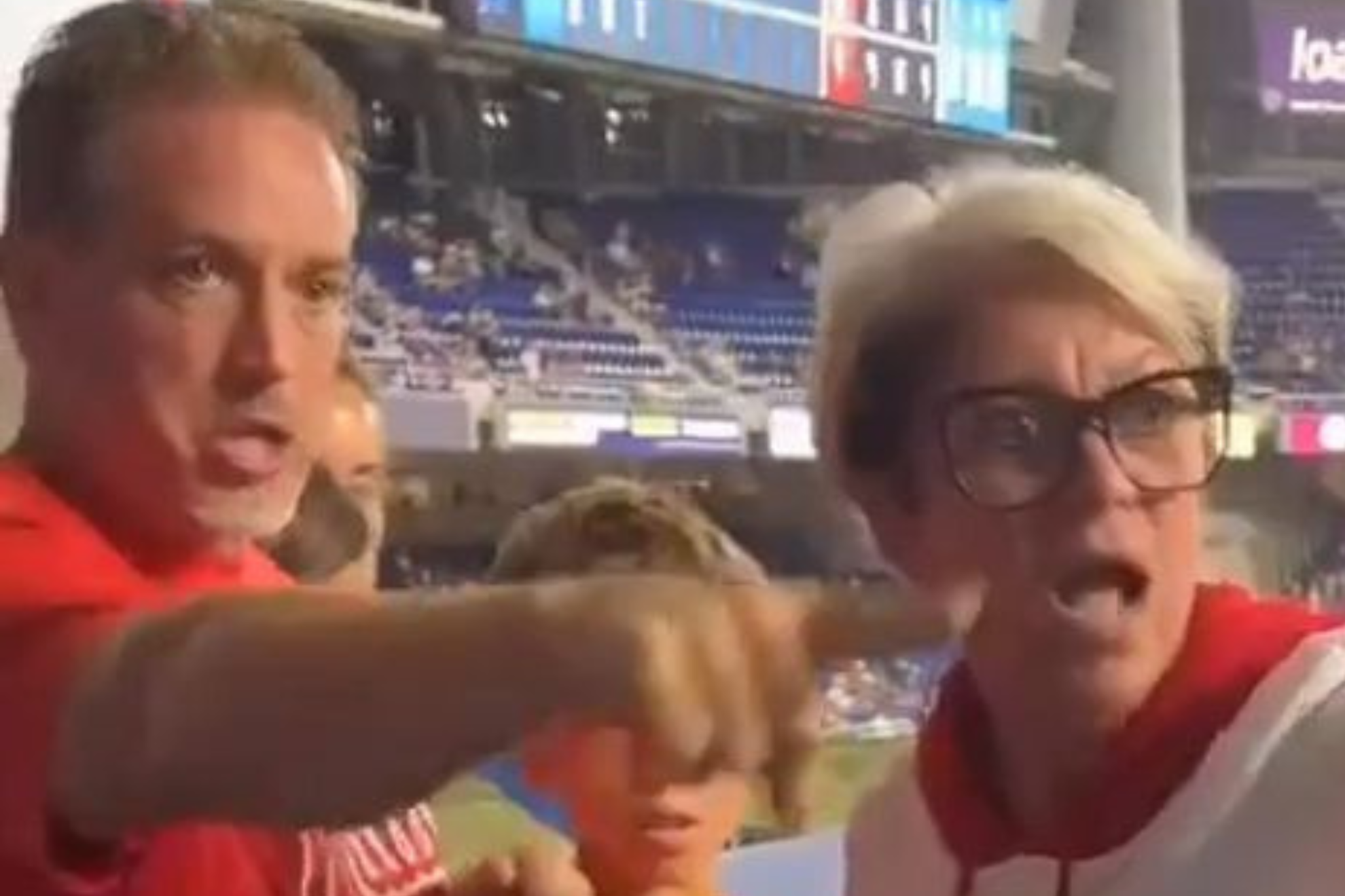 Phillies Karen argues with Philadelphia Phillies fan Drew Feltwell at LoanDepot Park in Miami, Florida.