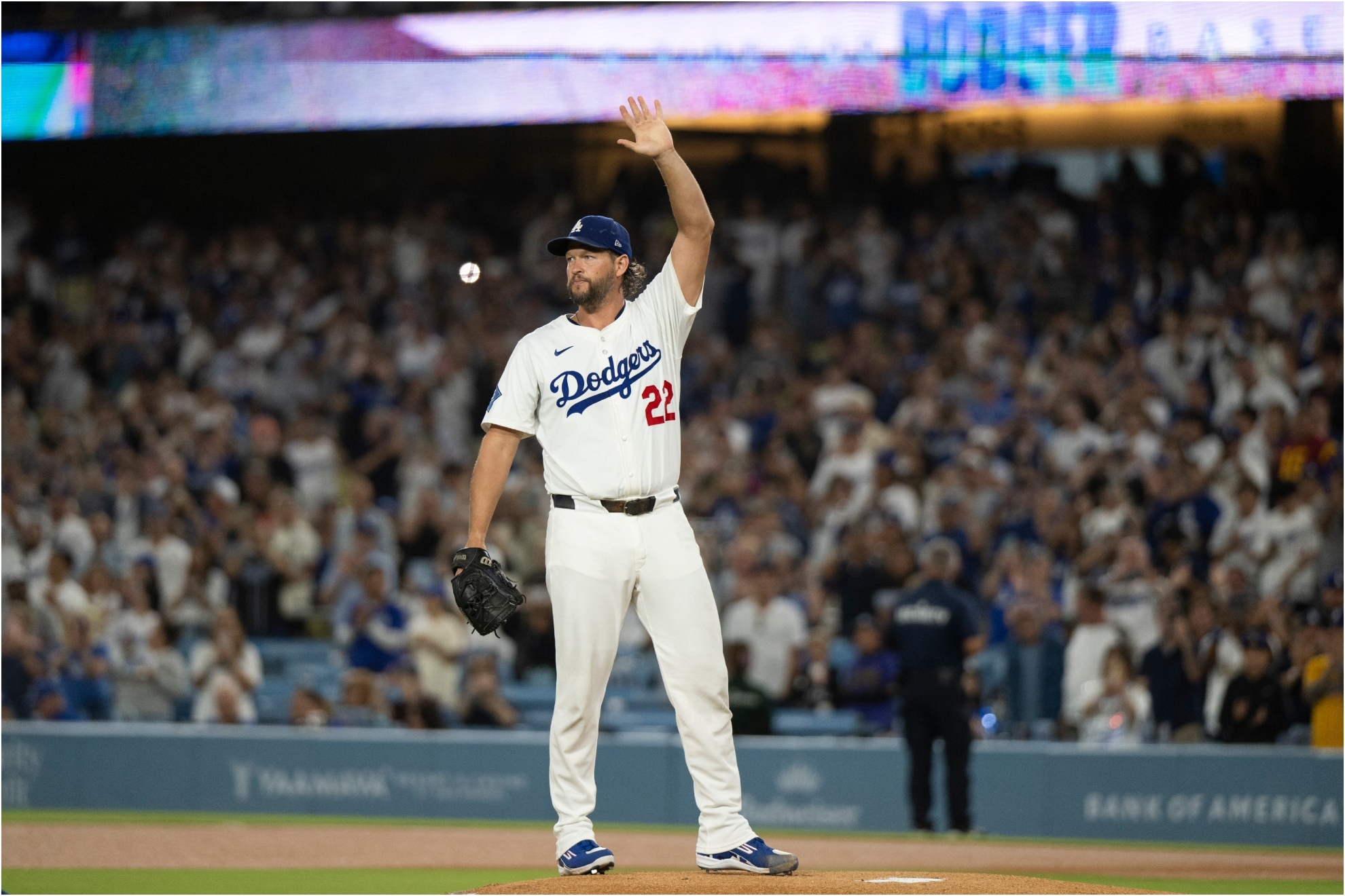 Los Angeles Dodgers starting pitcher Clayton Kershaw waves toward the stands.