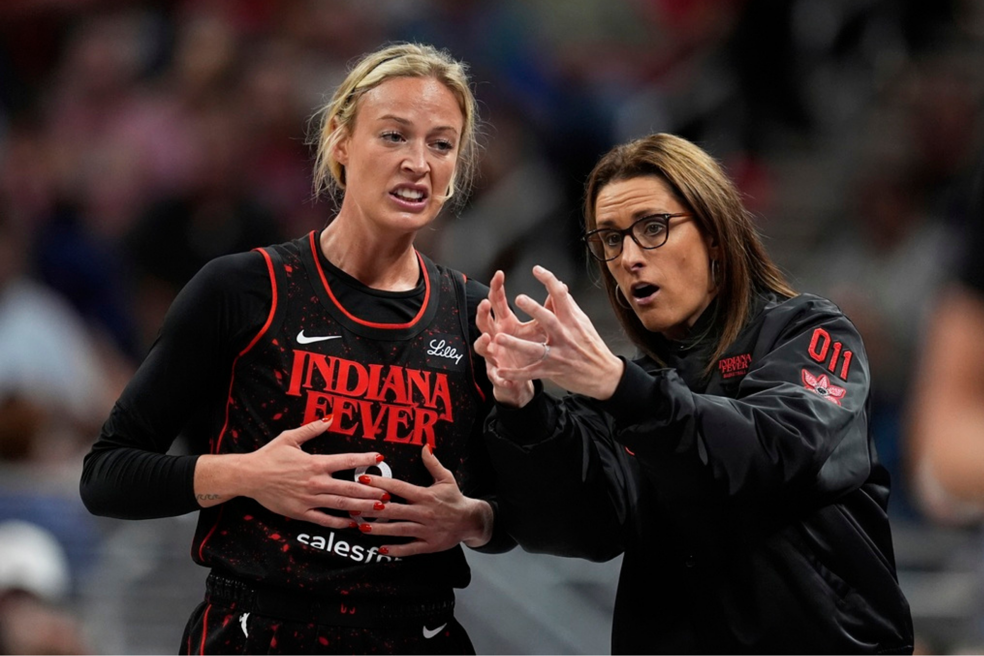 Indiana Fever head coach Stephanie White talks with Sophie Cunningham