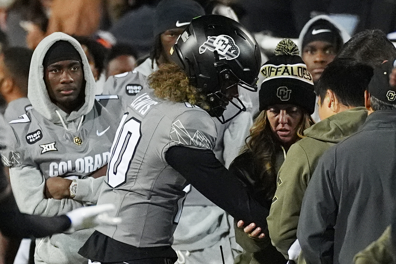 Julian Lewis is checked after injuring his arm late in the second half